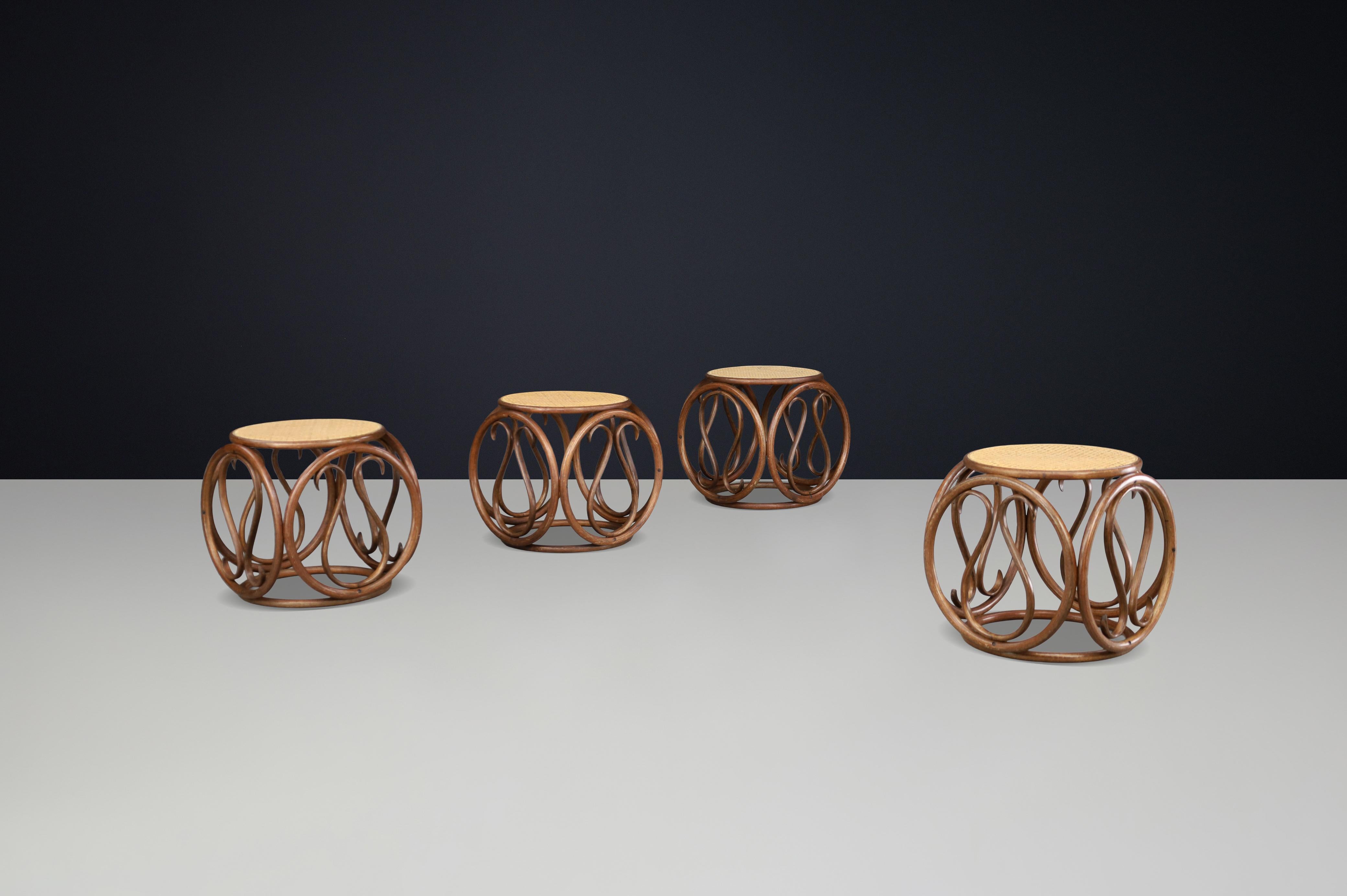 Set of Four 1960s Austrian Bentwood and Cane Stools / Side Tables Attributed to Michael Thonet

This elegant set of four 1960s bentwood and cane stools or side tables, attributed to the renowned Austrian designer Michael Thonet, exemplifies the
