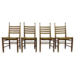 Ensemble de quatre chaises de salle à manger en hêtre et jonc des années 1960