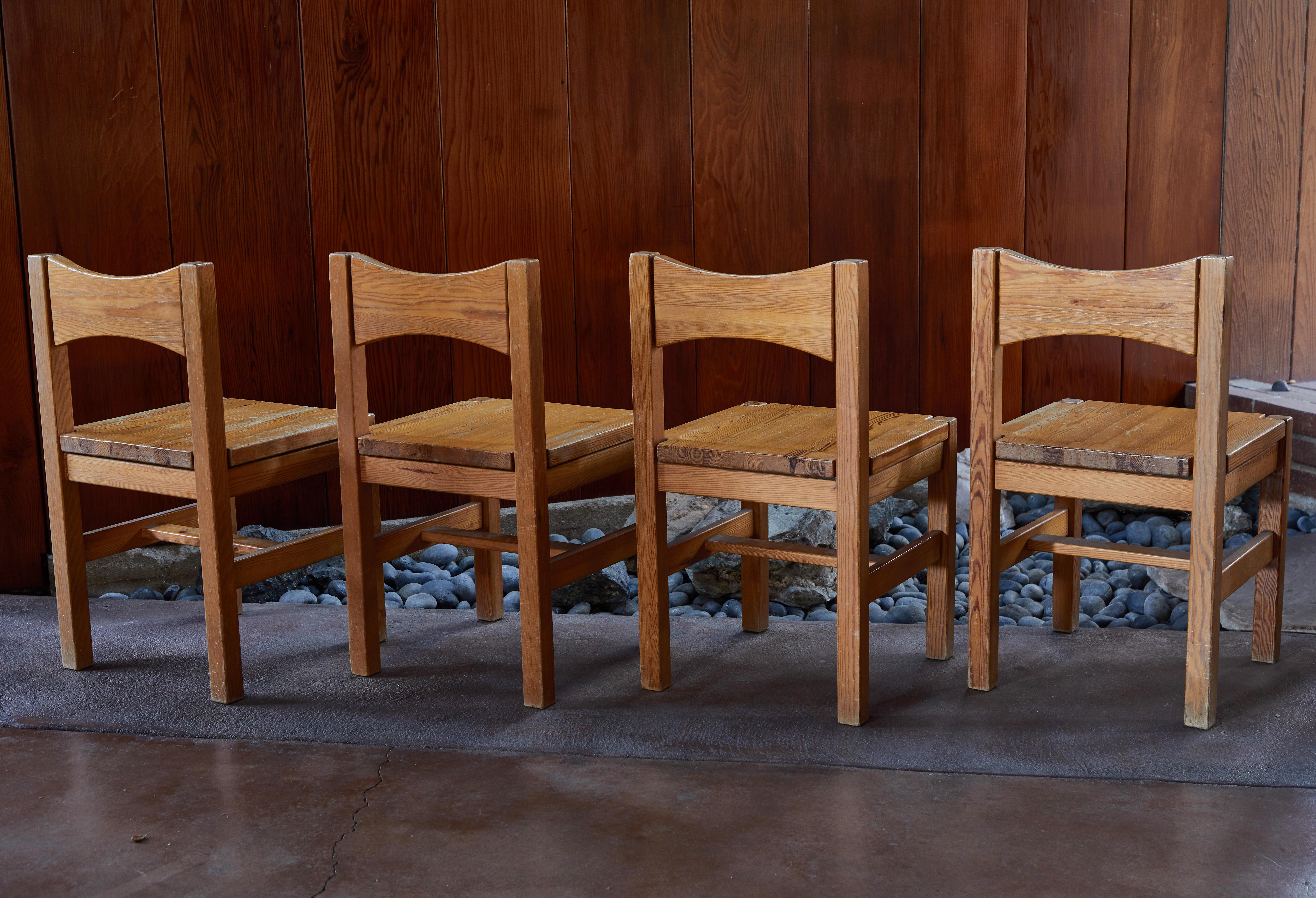 Set of four 1960s Ilmari Tapiovaara dining chairs for Laukaan Puu Oy, Finland. Executed in solid pine. Designed in 1963, these Fine chairs are similar in its refined spirit to Tapiovaara's celebrated Domus. A quintessential example of Finnish