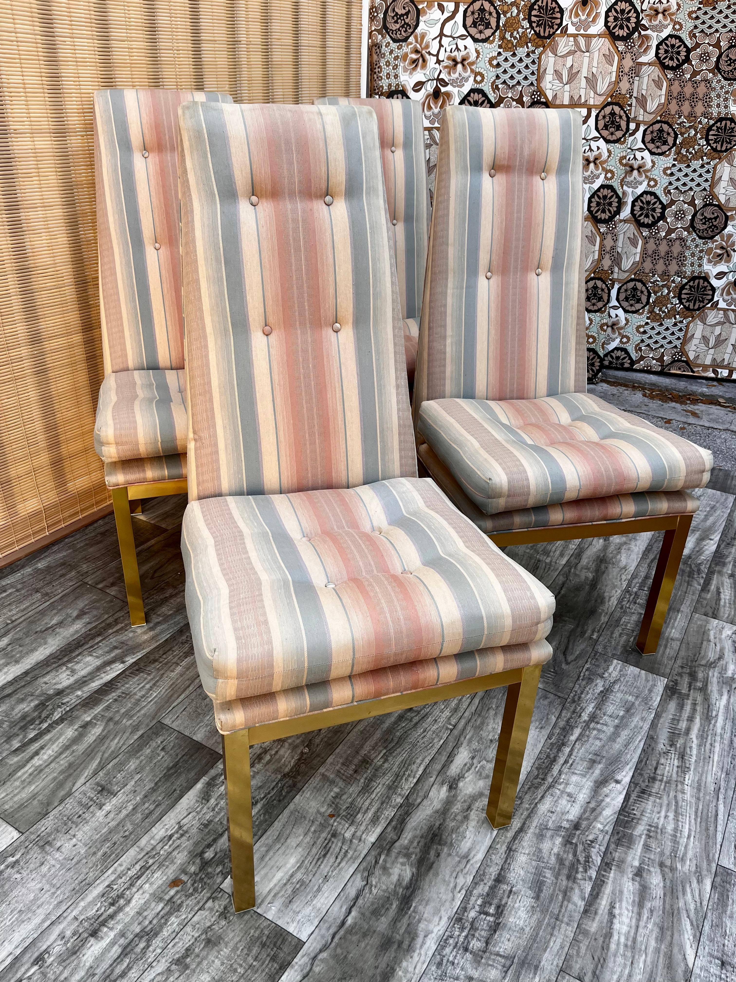 Set of four vintage Mid-Century Modern upholstered dining chairs in the Adrain Pearsall's Style. circa 1960s.
Feature a quintessential Mid-Century Modern high back design with tufted pastel colors striped upholstery and golden anodized aluminum