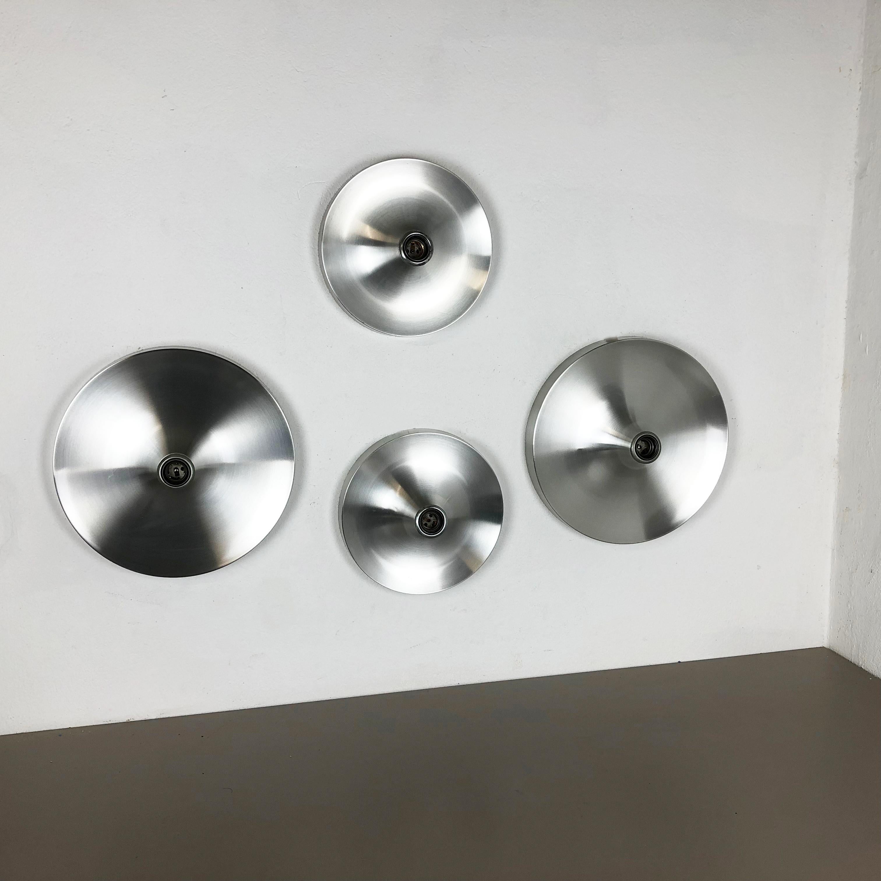 Article:

Set of four wall light sconces



Origin:

Germany


Producer:

TEKA Lights, Germany



Age:

1970s


Set of three original 1970s modernist German wall light made of solid metal aluminum. This set was produced by Teka