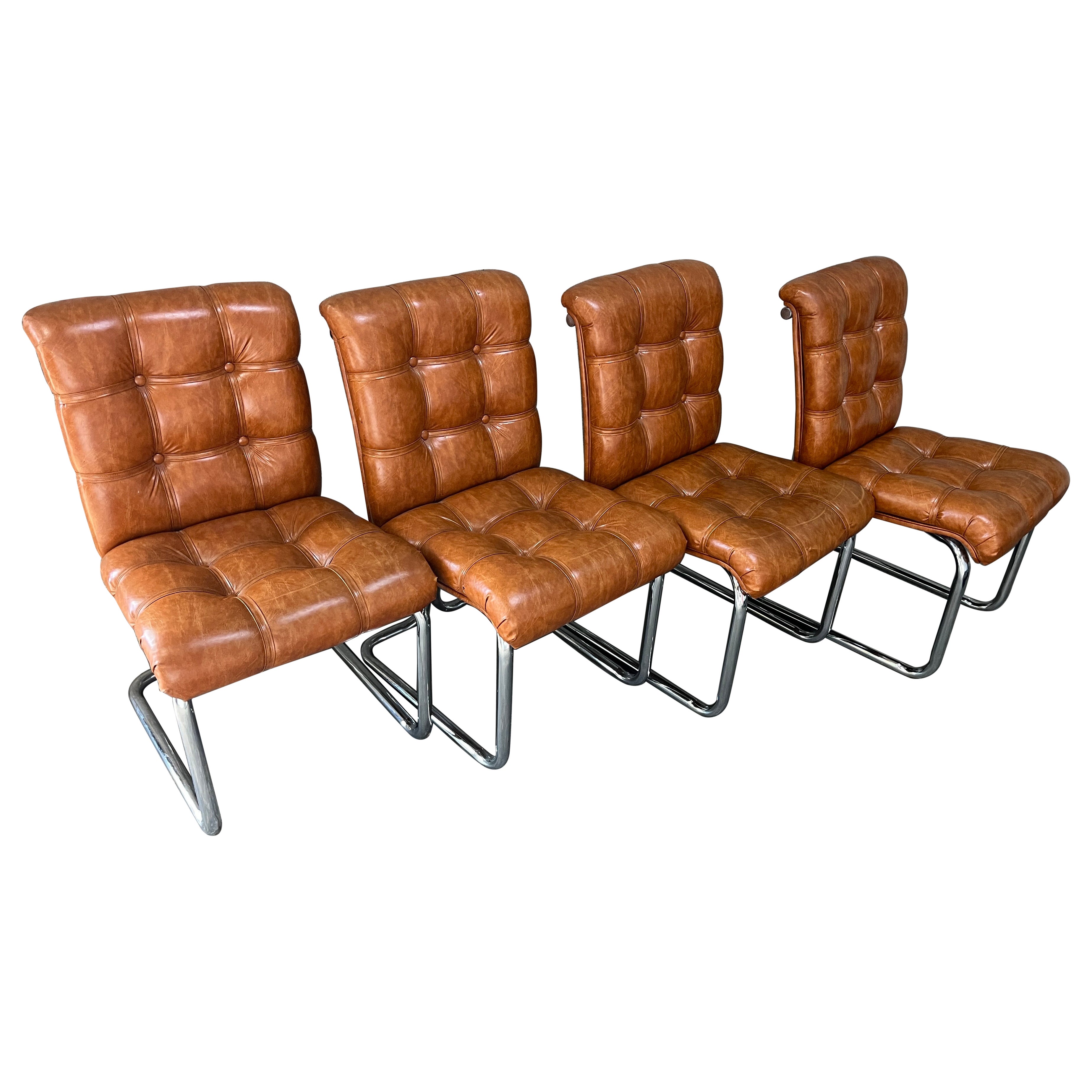 Set of Four 1970s Mid-Century Modern Dining Chairs in the Milo Baughman Style.