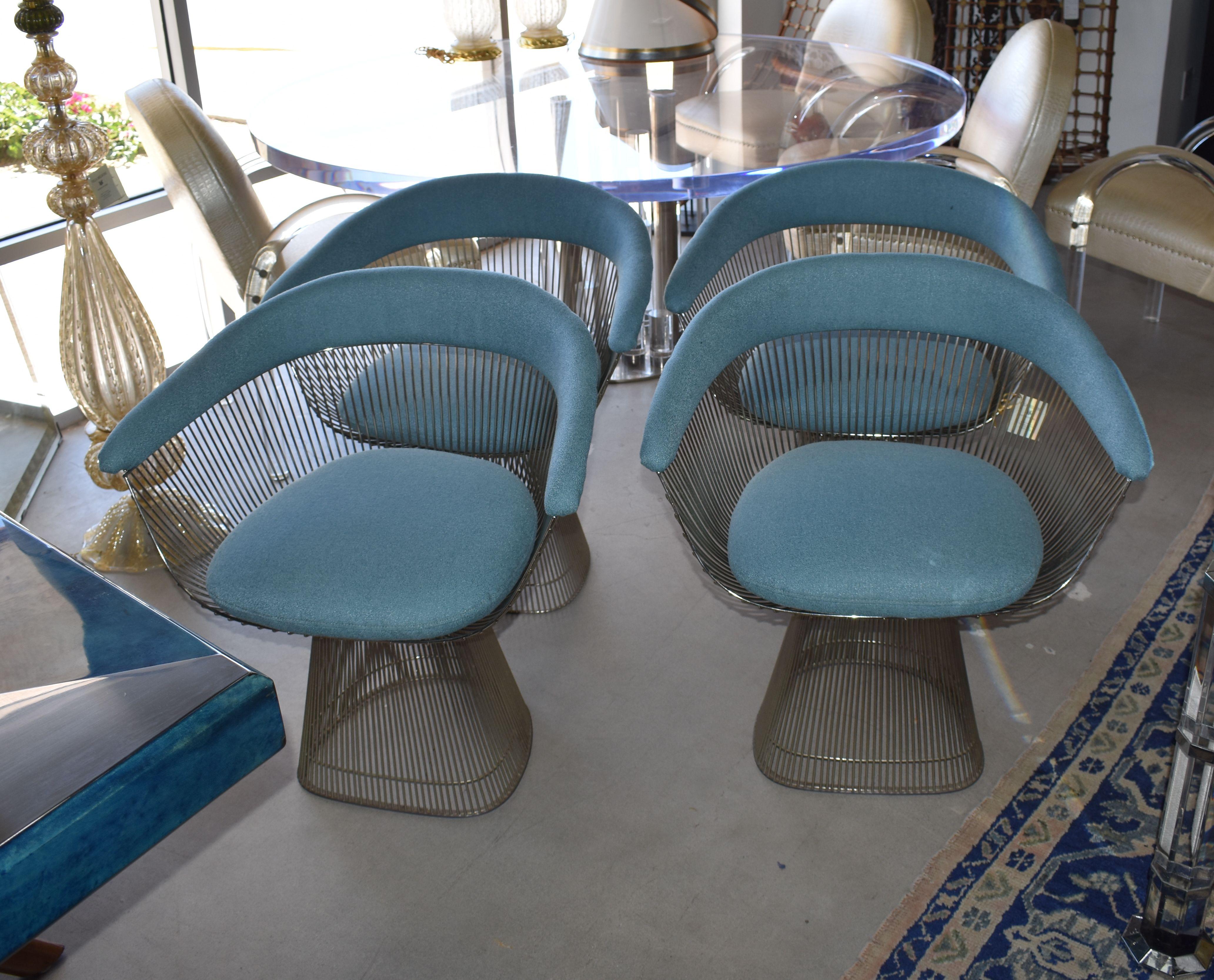 1970s, set of four armchairs cover with blue cotton fabric design by Warren Platner for Knollthe. The arm chair, which can be used as a dining chair or guess chair, is created by welding curved steel rods to circular and semi-circular frames,