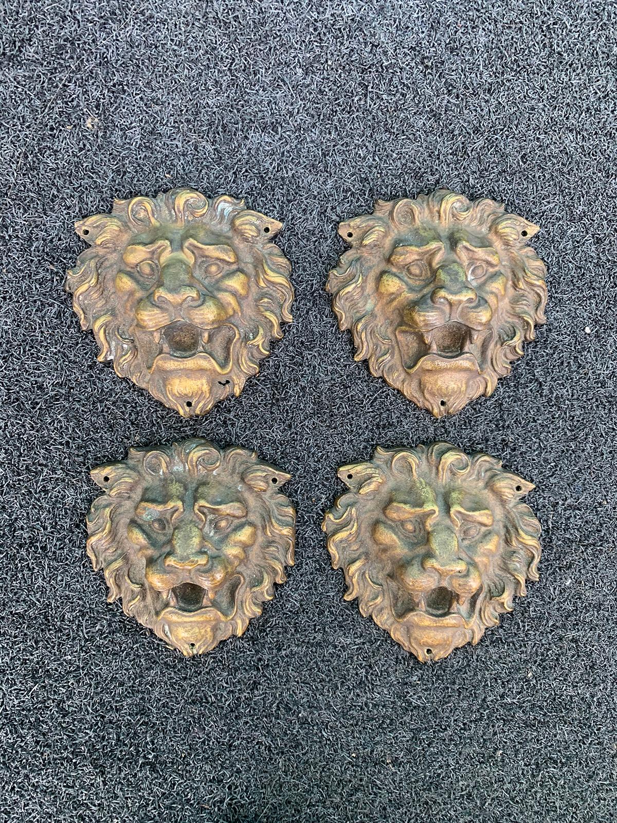 Set of four 19th-20th century bronze lion head medallions
Three holes for nails - by ears and chin.