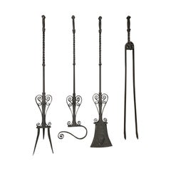 Set of Four 19th-20th Century Jumbo Black Iron Ornate Scrolled Fire Tools