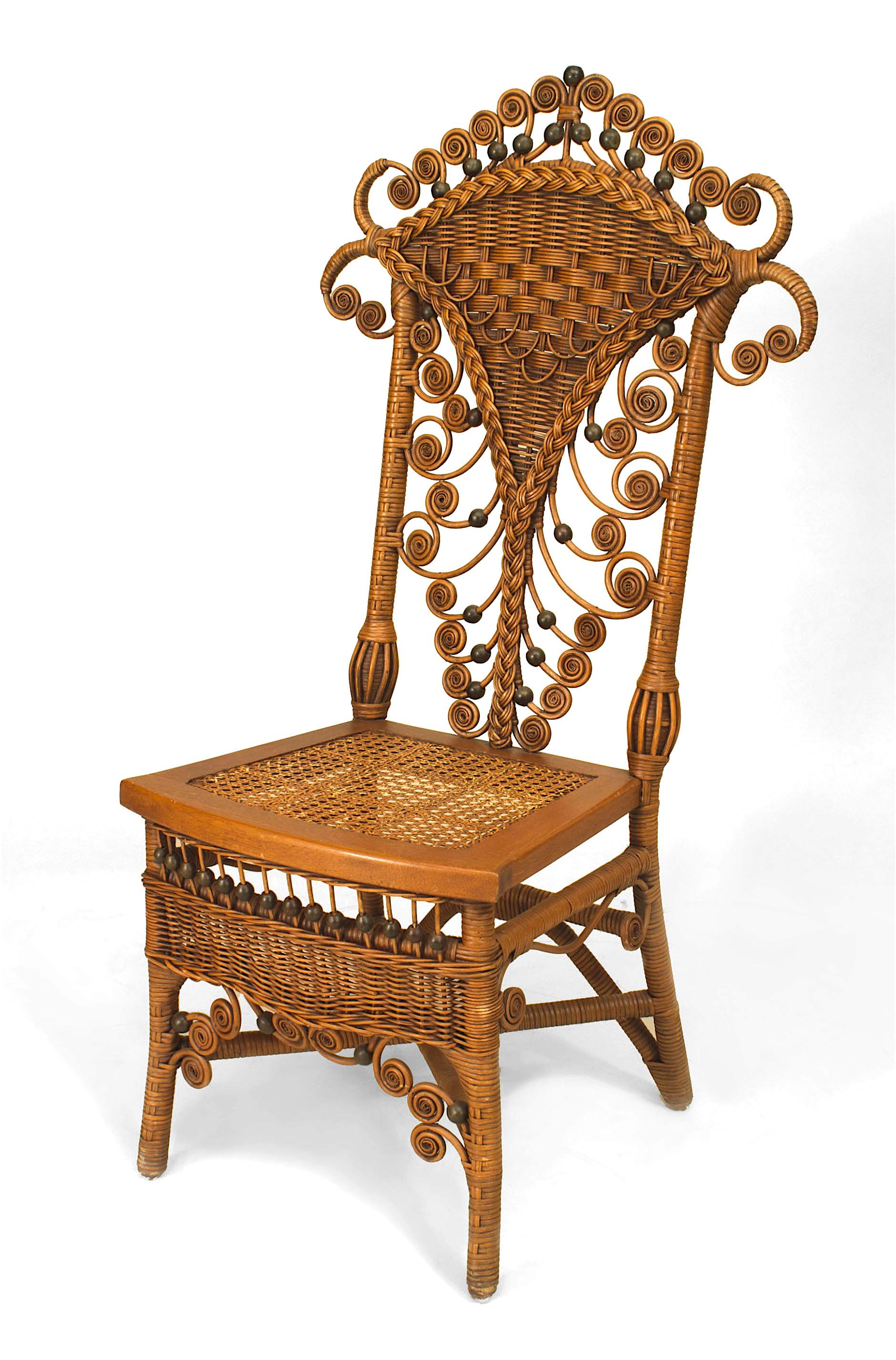 Set of 4 American Victorian natural wicker high back side chairs with woven back and cane seat with apron and having scroll & ball trim design. (matching dining table #060481)
