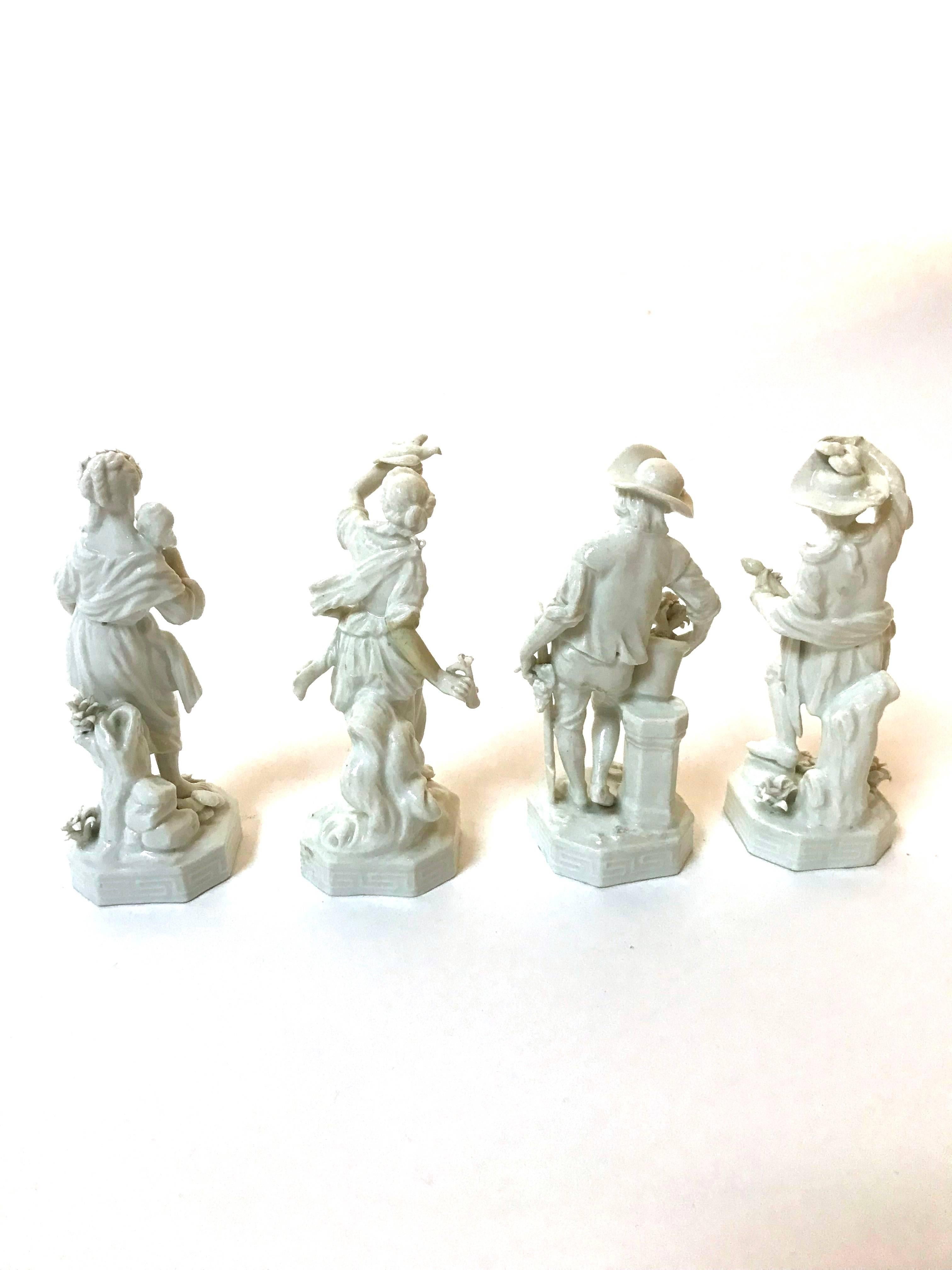 A nice set of four late 19th century blanc de chine porcelain allegorical figurines depicting the Four Seasons, with the blue Bindenschild (beehive) mark of Royal Vienna Porcelain.