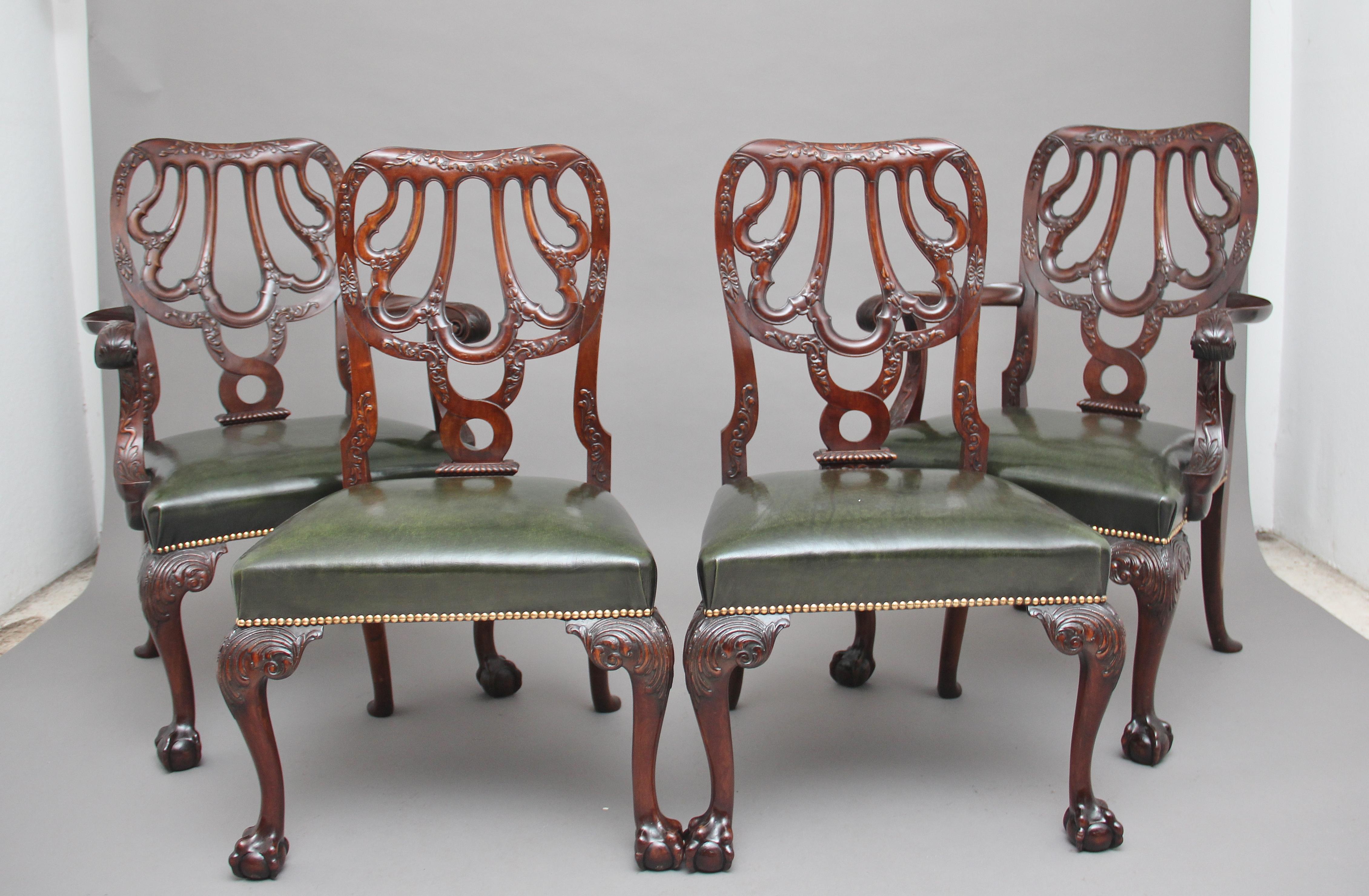 A set of four 19th century carved mahogany chairs in the Chippendale style, consisting of two armchairs and two side chairs, superb quality and lovely dense timber, having carved and shaped backs with flower foliage design, the seats having been