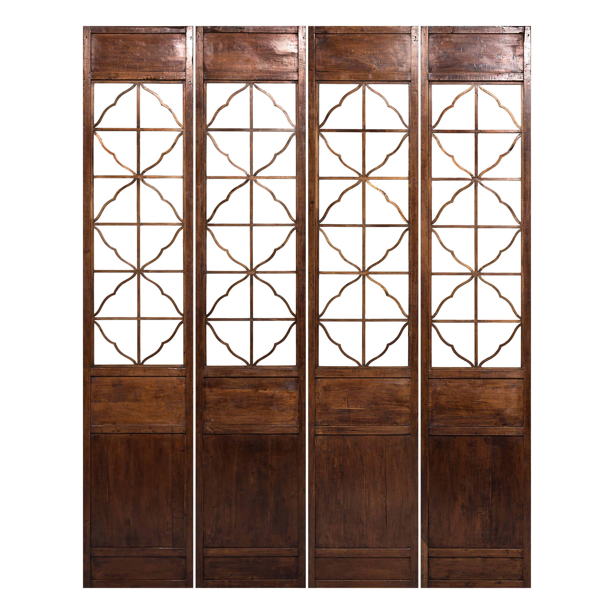 It is unusual to find such a fine set of 19th century Chinese lattice panels hand carved from walnut. Despite their grand height, the panels feel light and delicate thanks to open latticework designed to allow airflow between rooms. Originally a