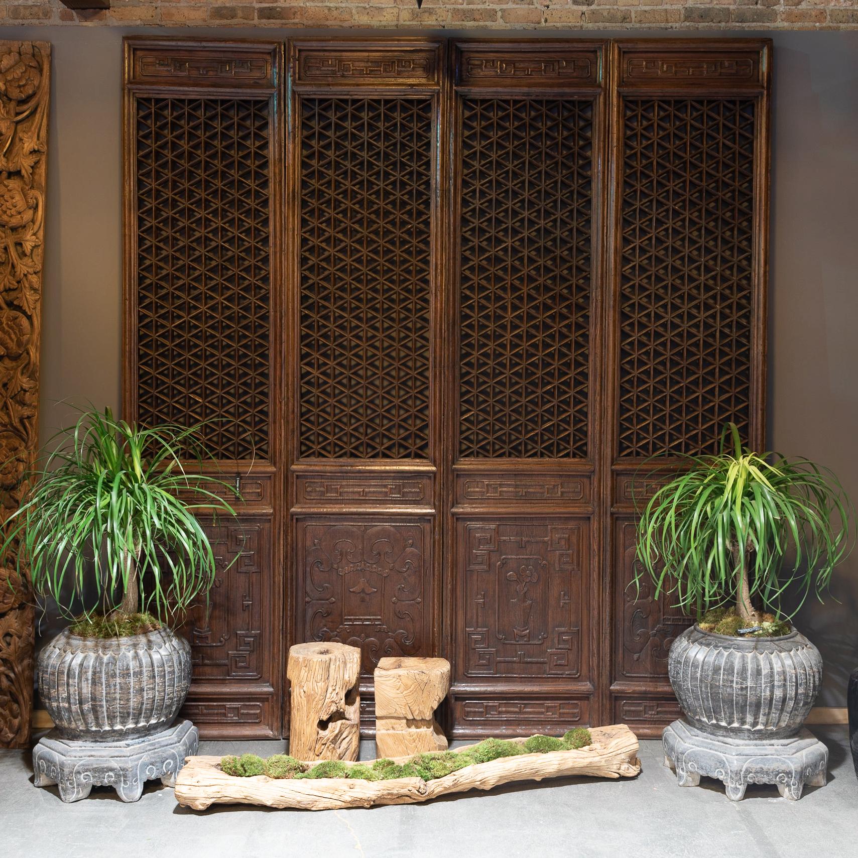 A hallmark of Qing-dynasty domestic architecture, hand-carved lattice panels such as these were originally used in Provincial courtyard homes to allow light and air into a room while maintaining privacy. Made of southern elm, known as jumu, the