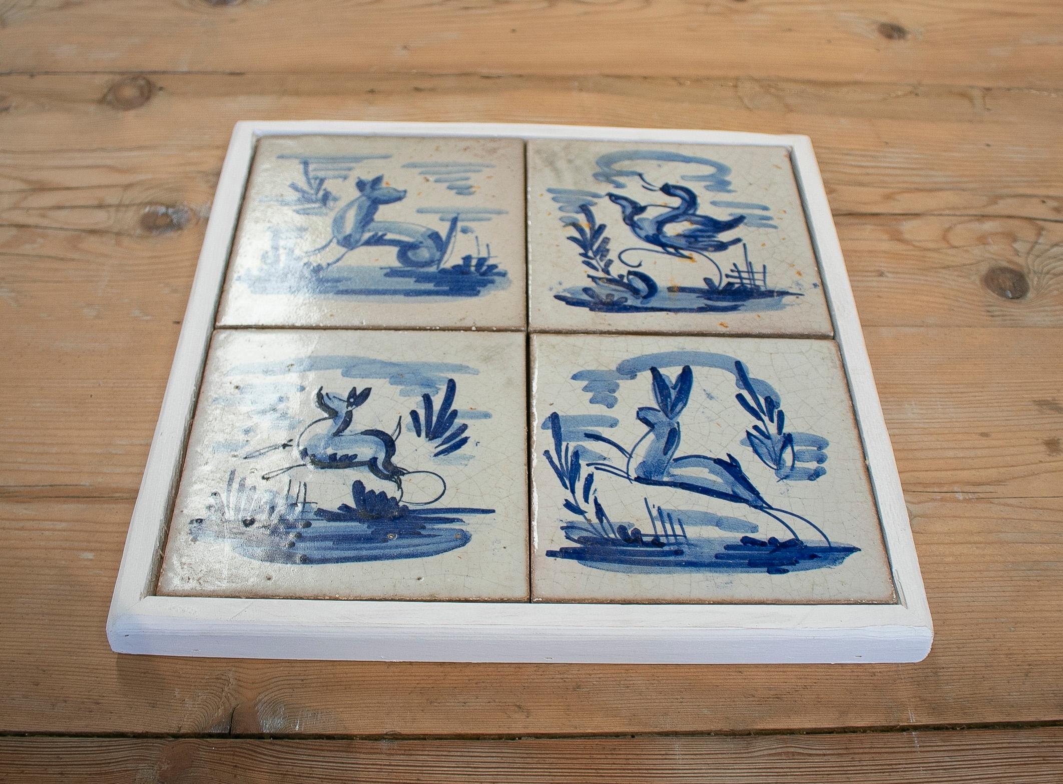 Set of four 19th century Dutch Delftware hand painted glazed ceramic tiles, framed

Dimensions exclude frame.