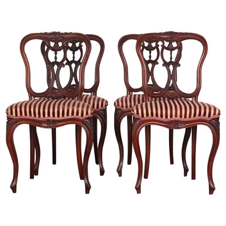 Set of Four 19th Century French Carved Mahogany Chairs