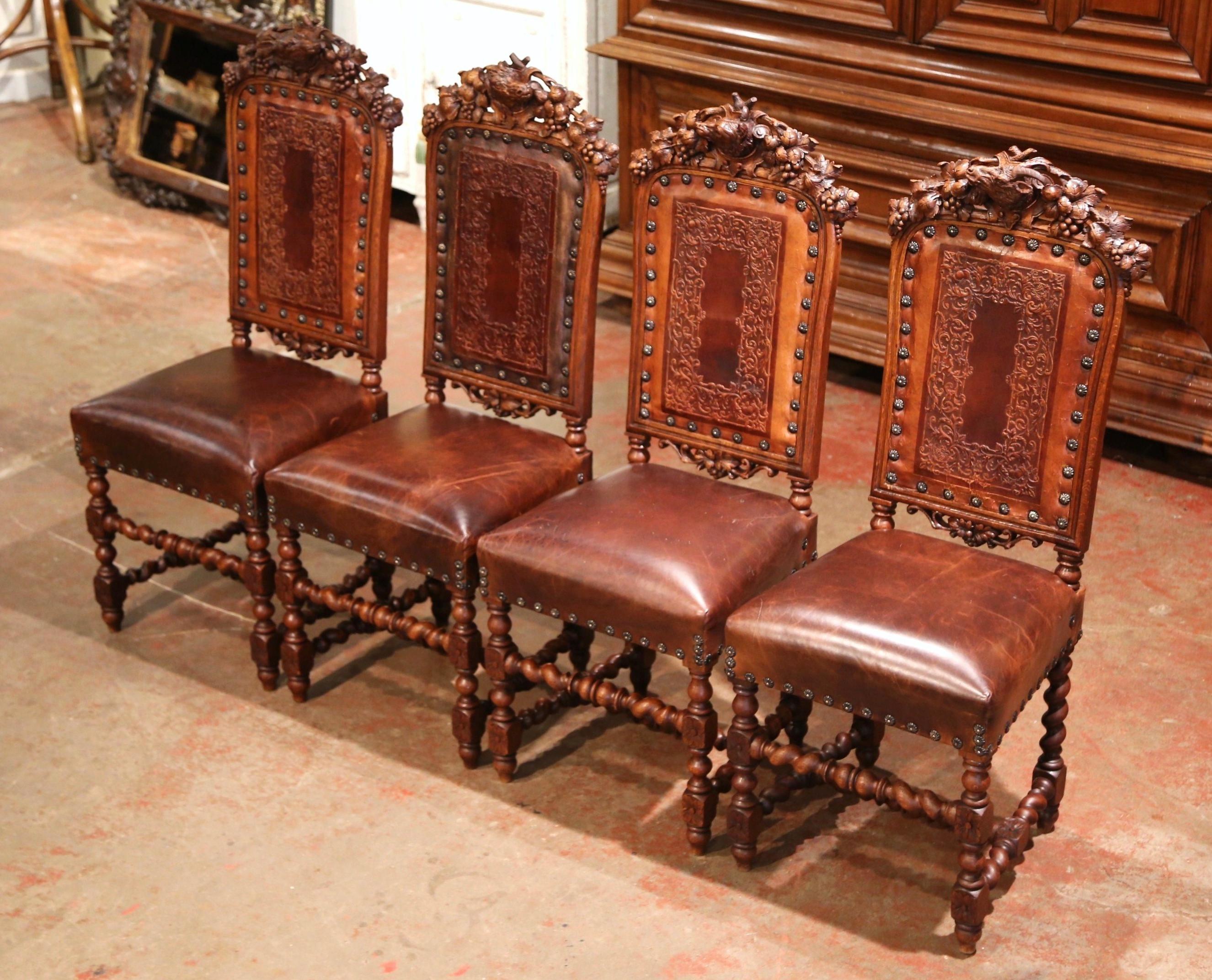 Louis XIII Set of Four 19th Century French Carved Oak and Leather Chairs with Hunt Motifs
