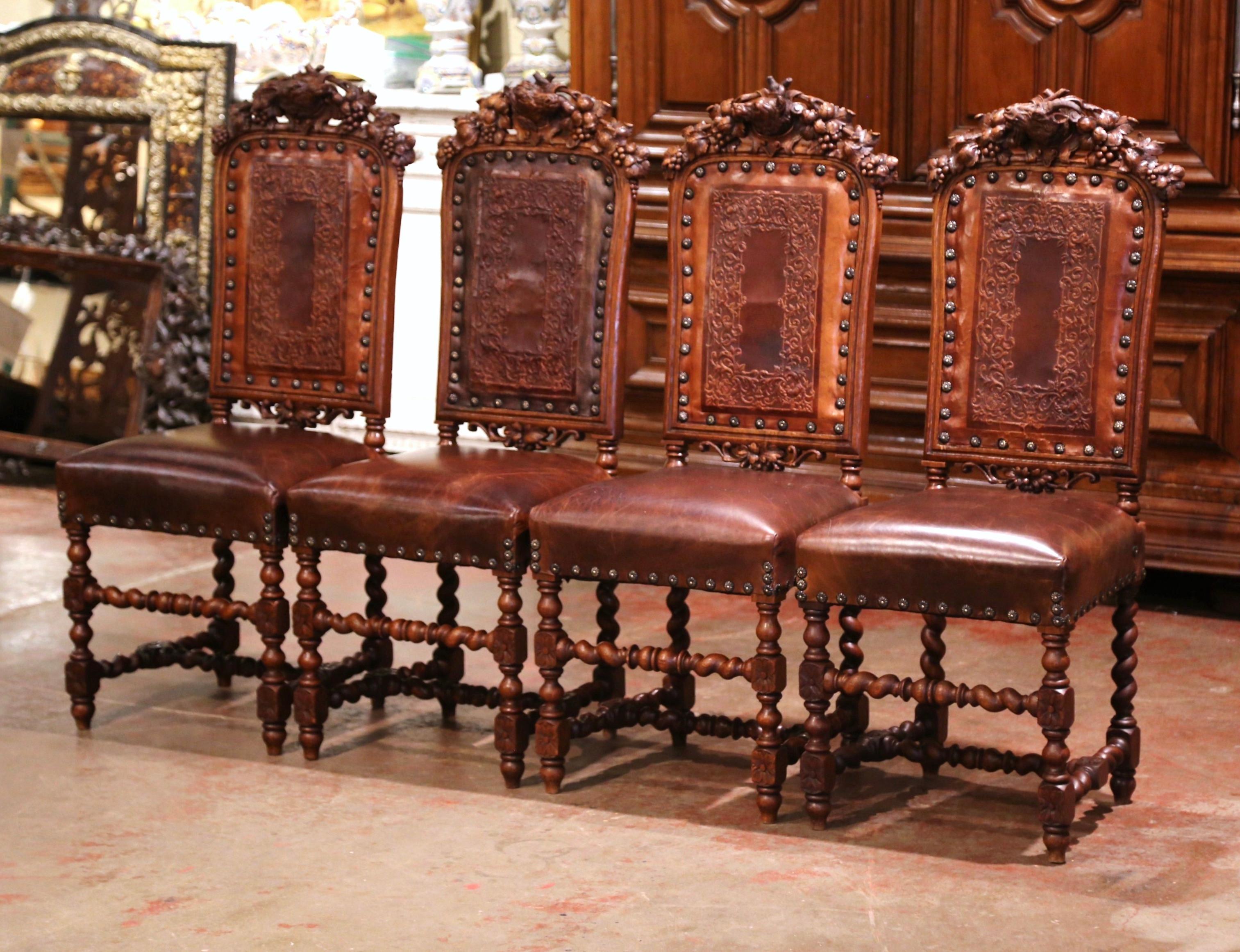 Hand-Carved Set of Four 19th Century French Carved Oak and Leather Chairs with Hunt Motifs