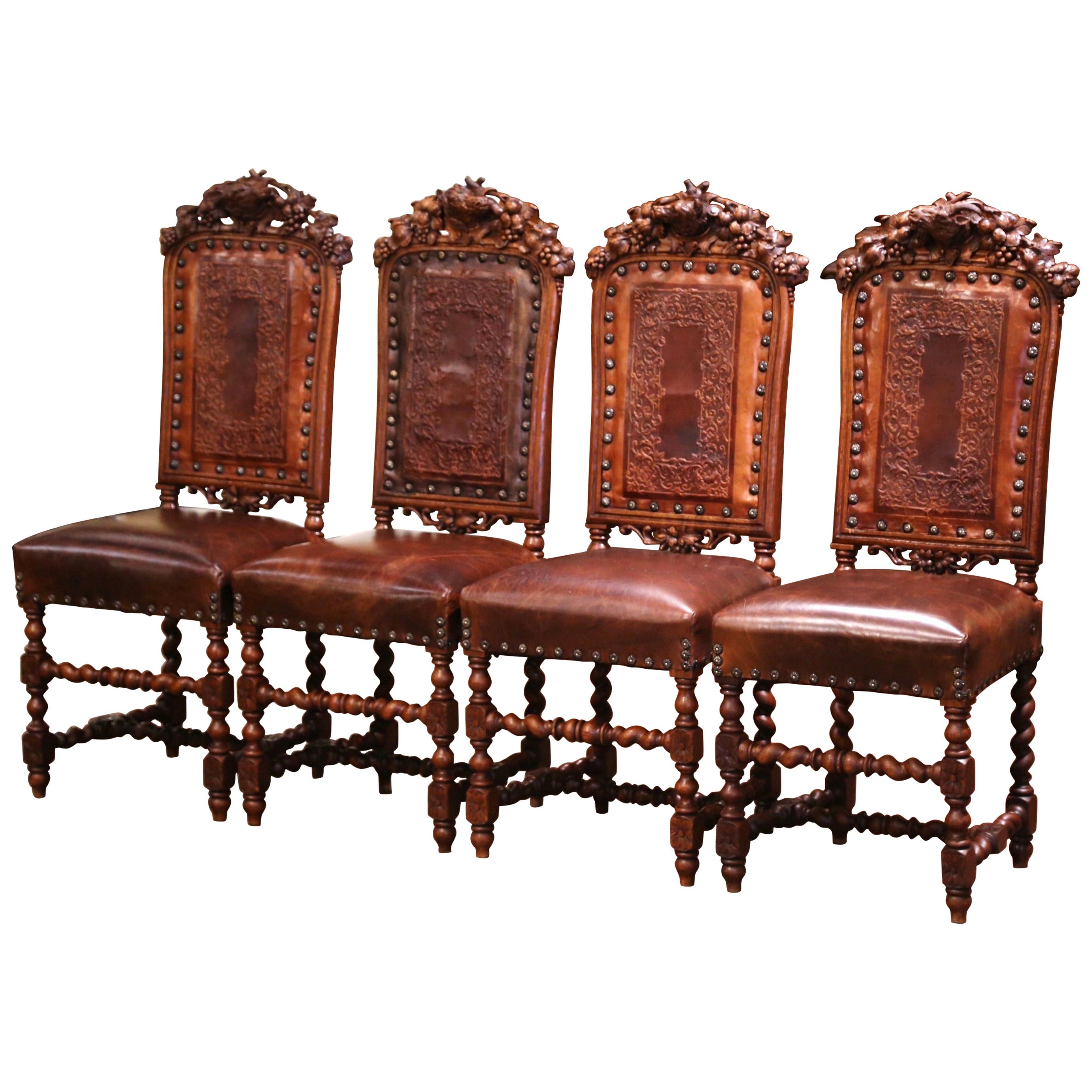 Set of Four 19th Century French Carved Oak and Leather Chairs with Hunt Motifs