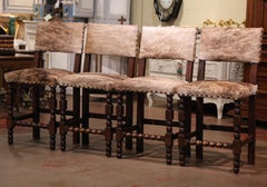 Set of Four 19th Century French Carved Oak, Leather and Cow Hide Bar Stools