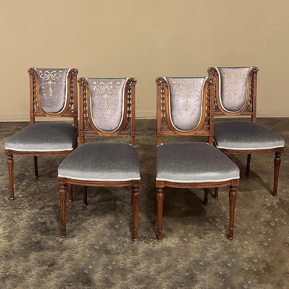 Set of Four 19th century French Louis XVI Walnut Salon Chairs with Embroidered Mohair are the perfect choice for any occasional use anywhere in the home. handcrafted from sumptuous French walnut, each features a lyre-shaped back framed with lush