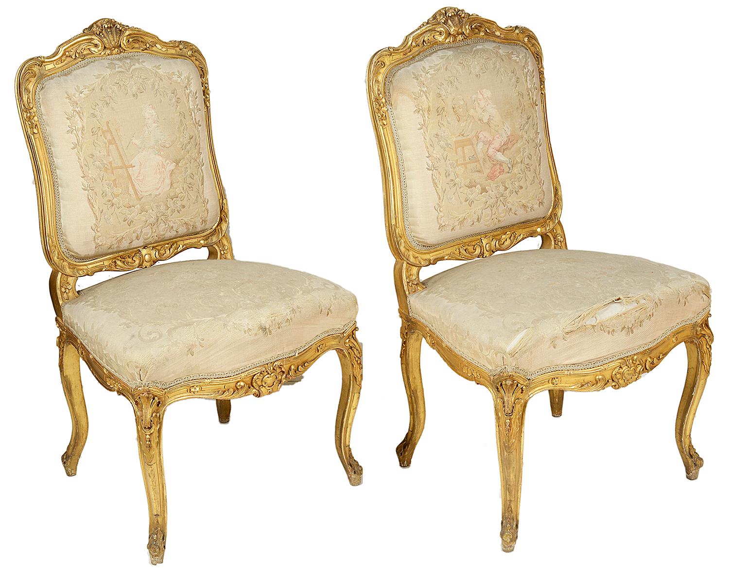 A good quality set of four carved giltwood salon side chairs, each with scrolling foliate decoration to the show frames, tapestry backs depicting artists and musicians at work (some ware to the seats) raised on elegant carved cabriole legs.