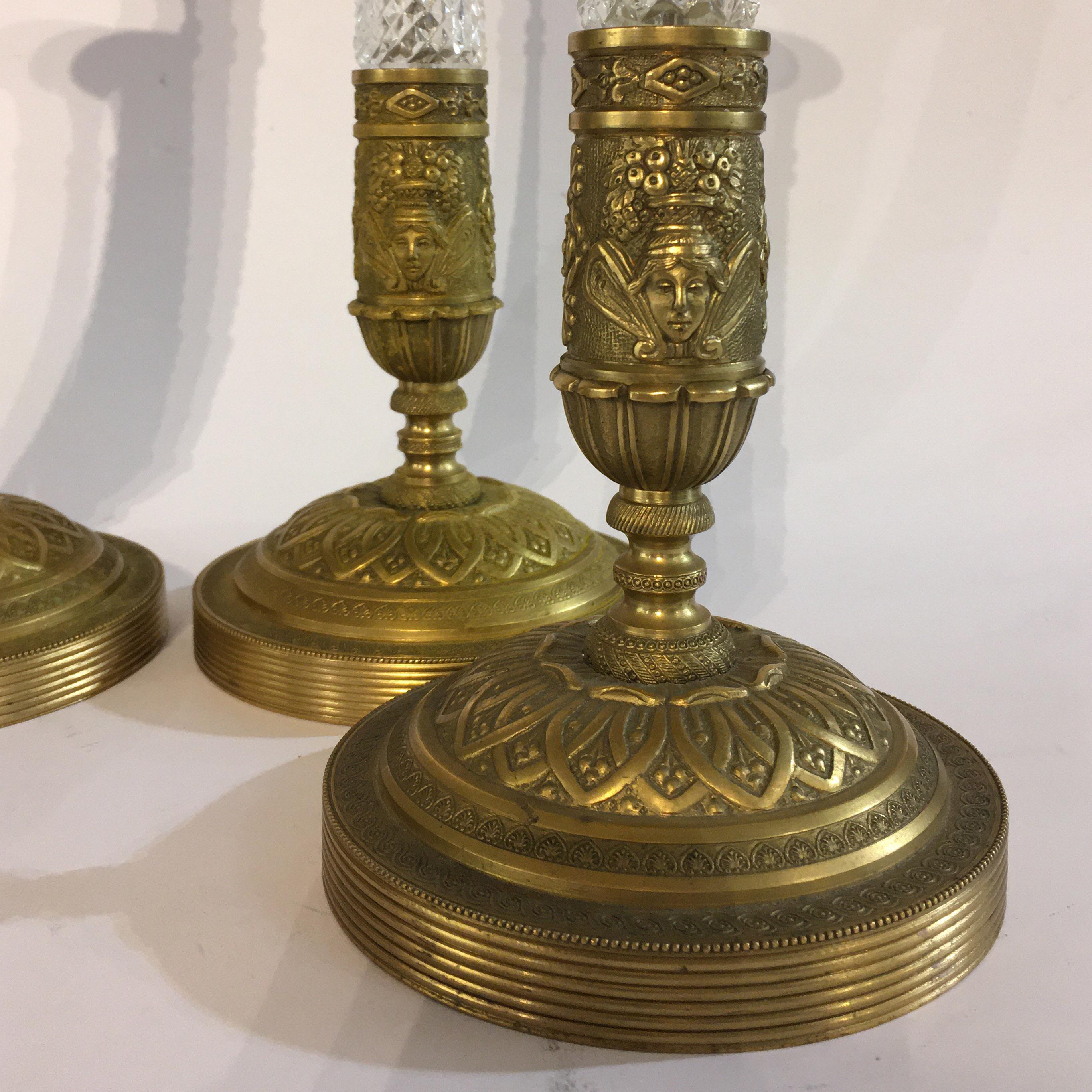 An elegant set of four candlesticks, which are made from gilt bronze and grinded crystal.
Italian manufactory from the second half of the 19th century.
  