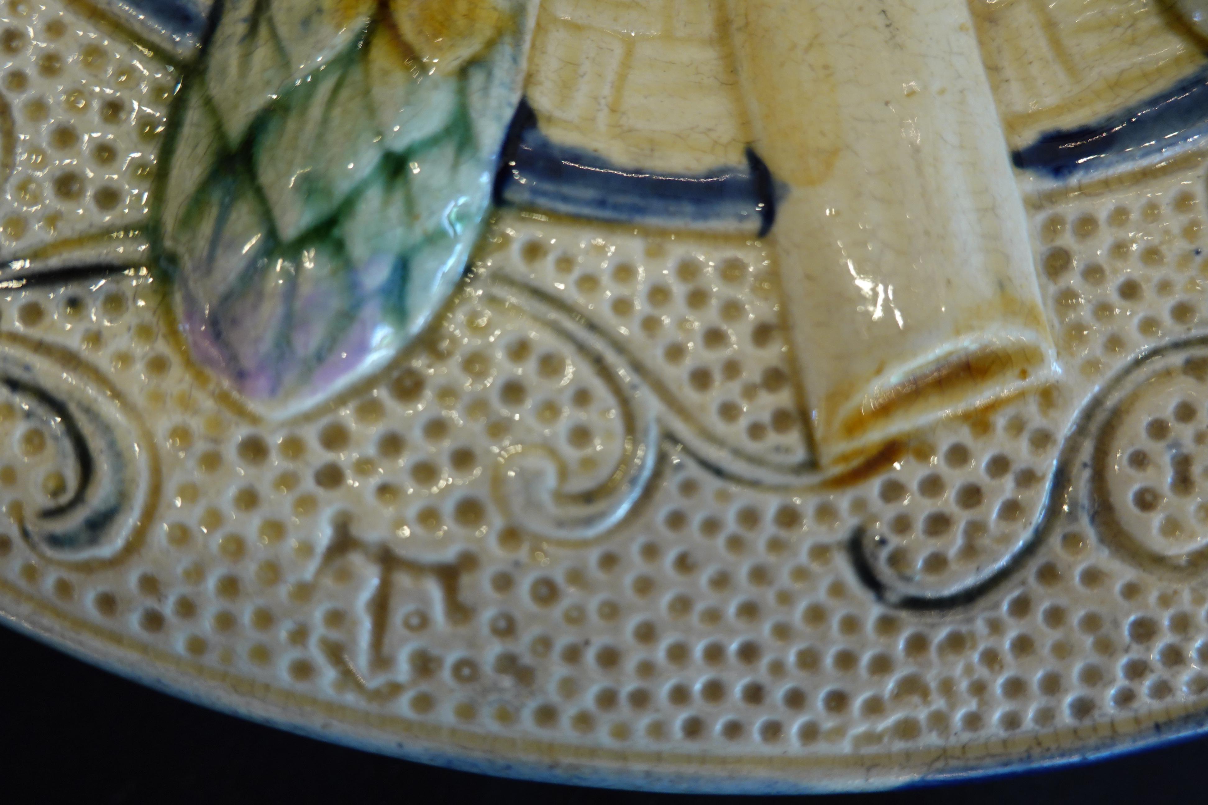 Glazed Set of Four 19th Century Majolica Asparagus Plates with Molded Sunflower For Sale
