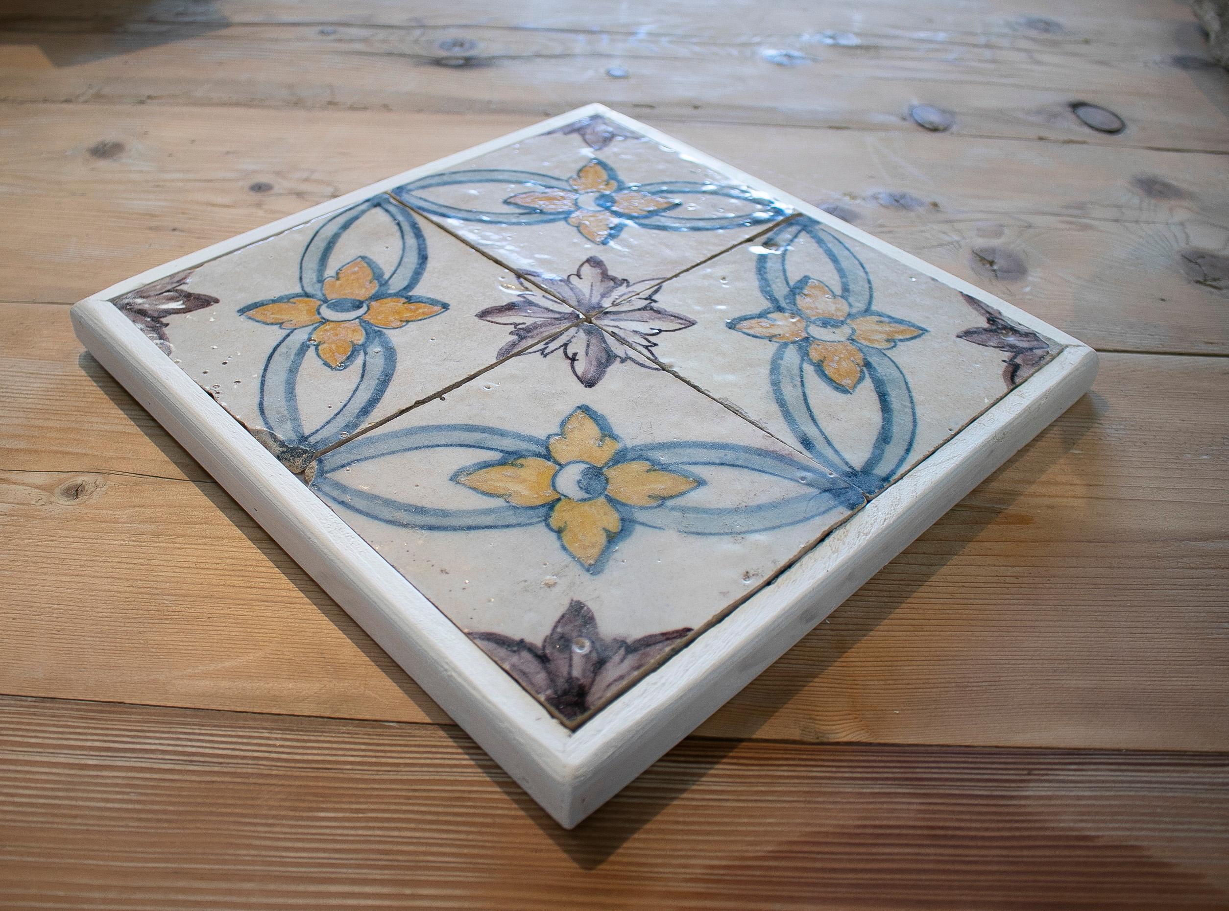 Antique set of four 19th century Portuguese hand painted glazed ceramic patterned tiles with white frame

Dimension do not include frame.