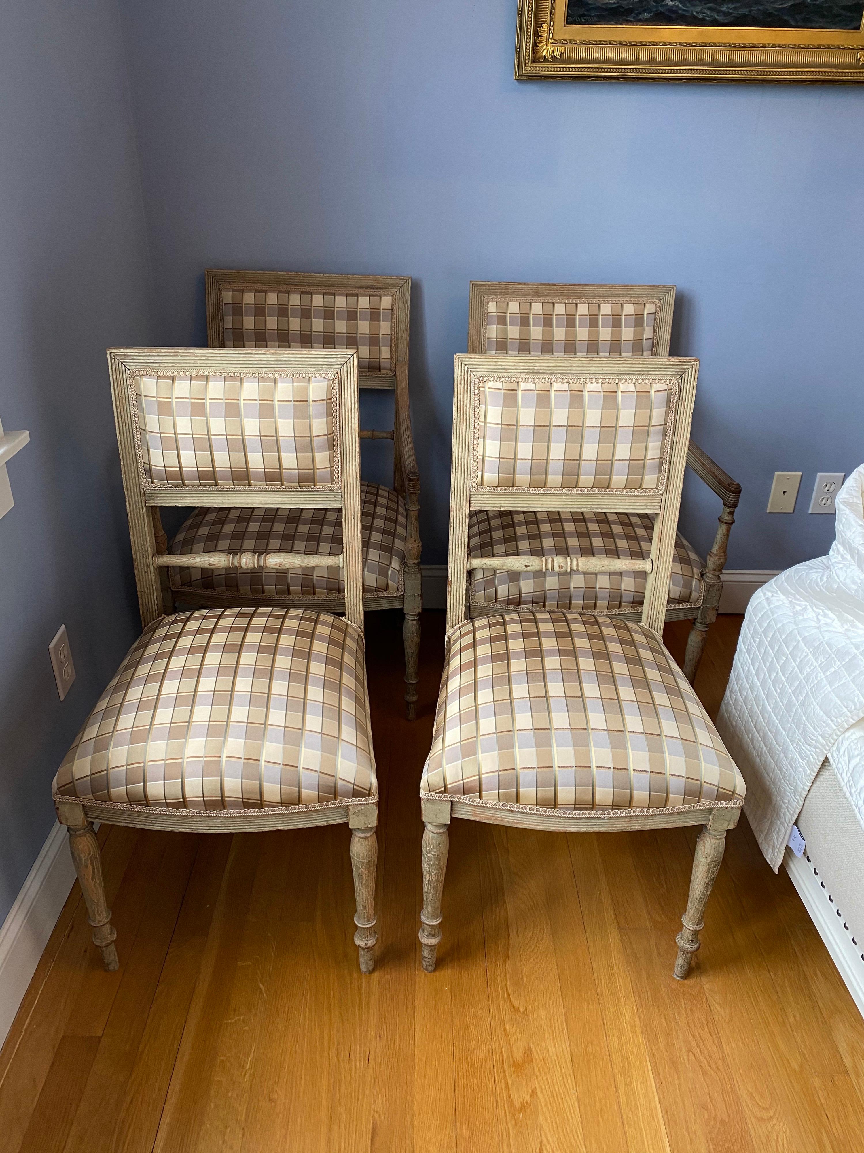 Set of four 19th century Swedish painted armchairs and side chairs in silk plaid.
Lovely design. Upholstery in silk plaid with small tape trim applied all around.
Structurally sound. Age to finish consistent with use.

Measures: Armchairs: 21.5