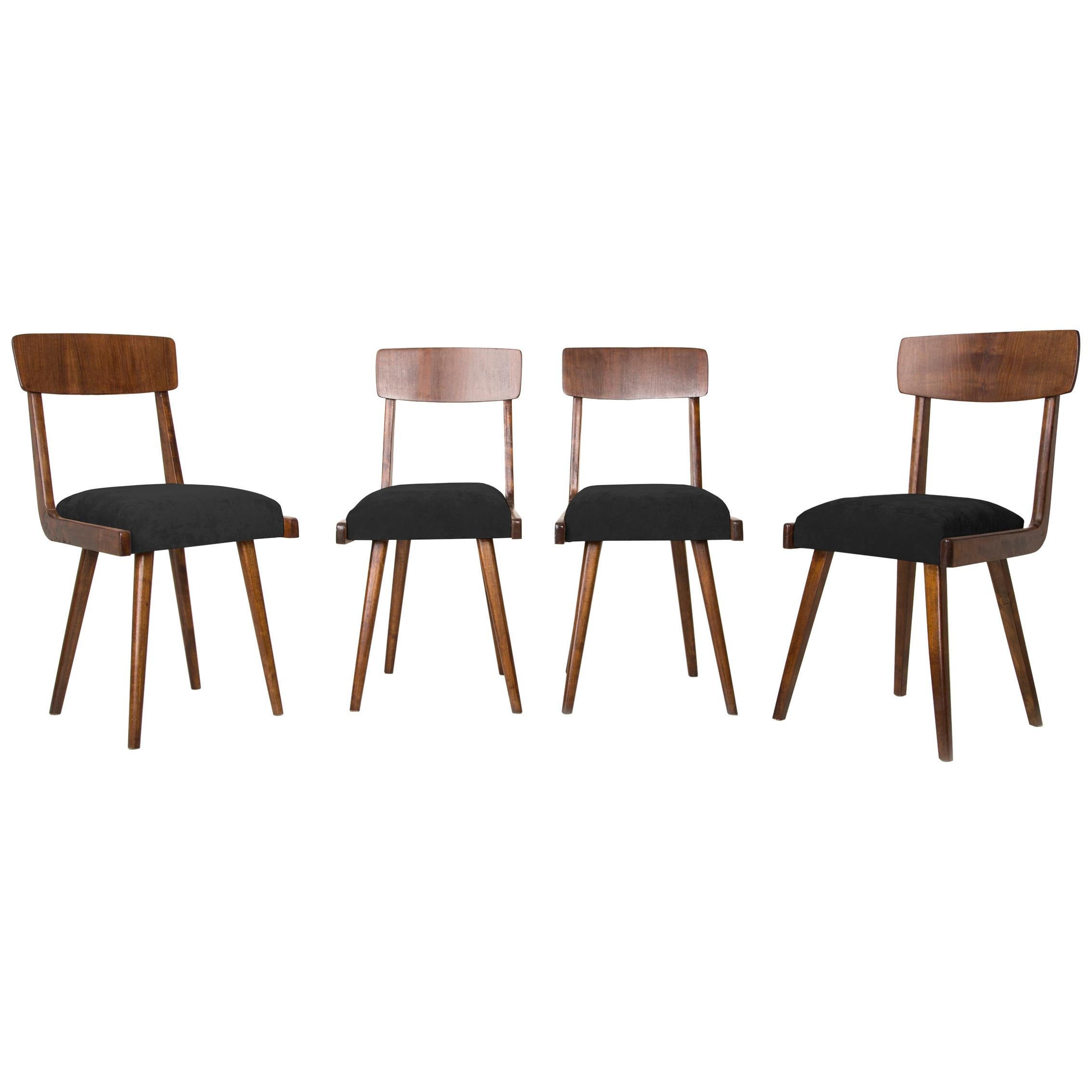 Ensemble de quatre chaises en bois noir du 20ème siècle, années 1960