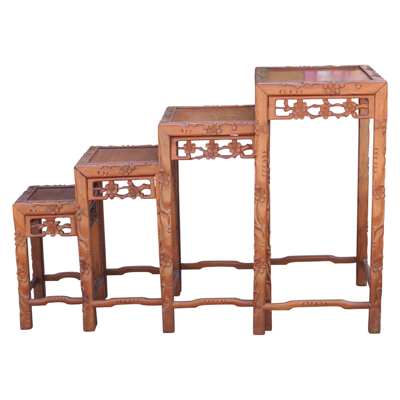 Modern Set of Four 20th Century Carved Chinese Nesting Tables with Fancy Floral Pattern