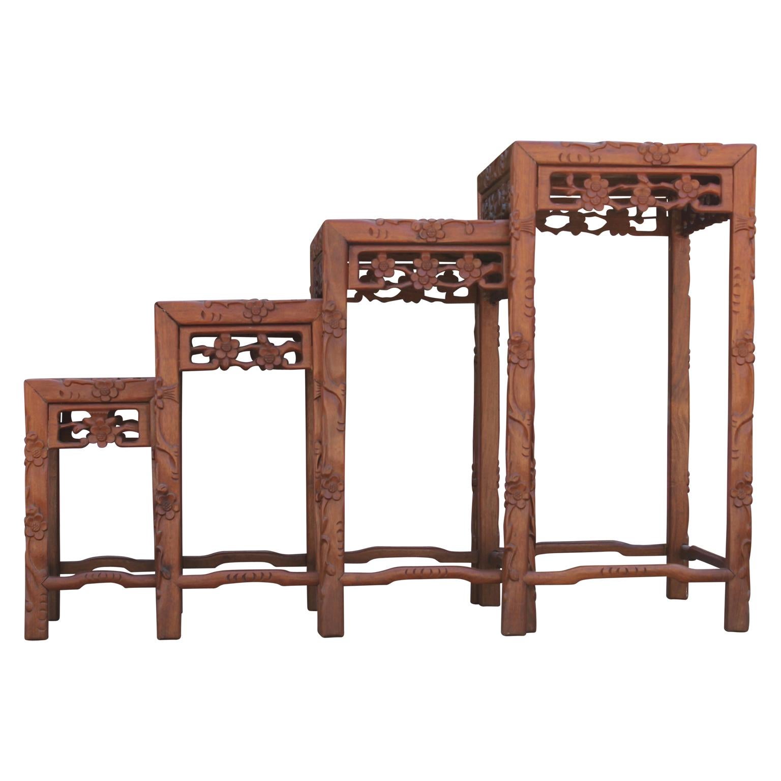 Set of Four 20th Century Carved Chinese Nesting Tables with Fancy Floral Pattern In Good Condition In Houston, TX