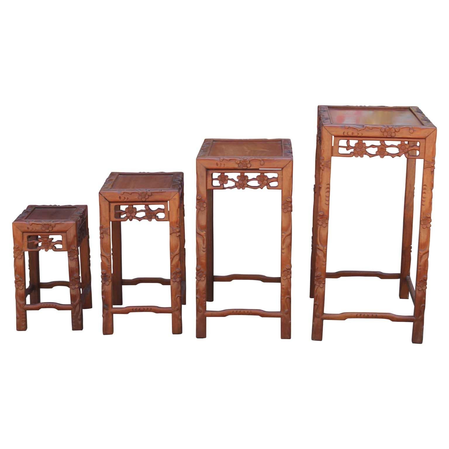 Wood Set of Four 20th Century Carved Chinese Nesting Tables with Fancy Floral Pattern