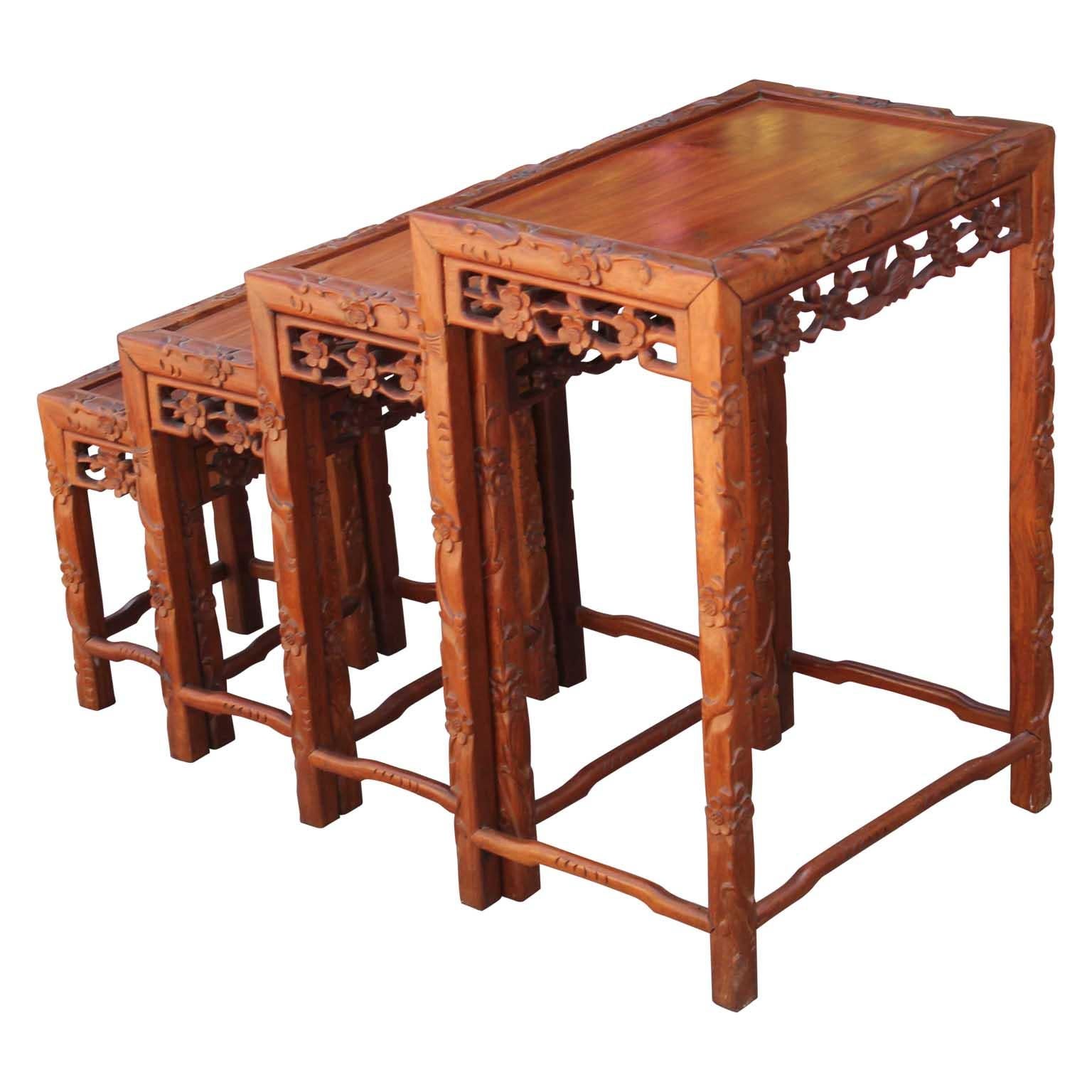 Set of Four 20th Century Carved Chinese Nesting Tables with Fancy Floral Pattern