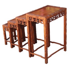 Vintage Set of Four 20th Century Carved Chinese Nesting Tables with Fancy Floral Pattern