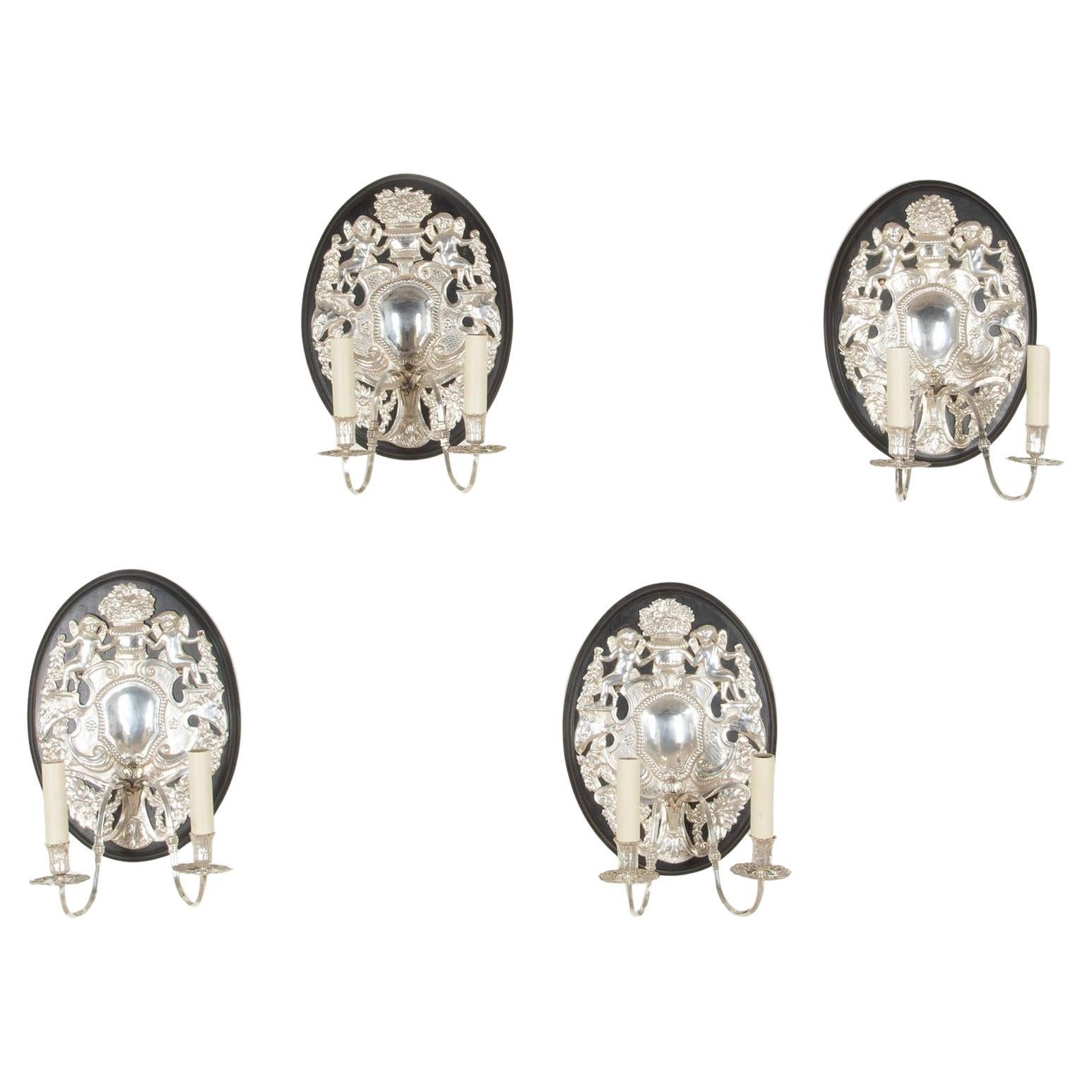 Set of Four 20th Century English Silver Repousé Wall Lights