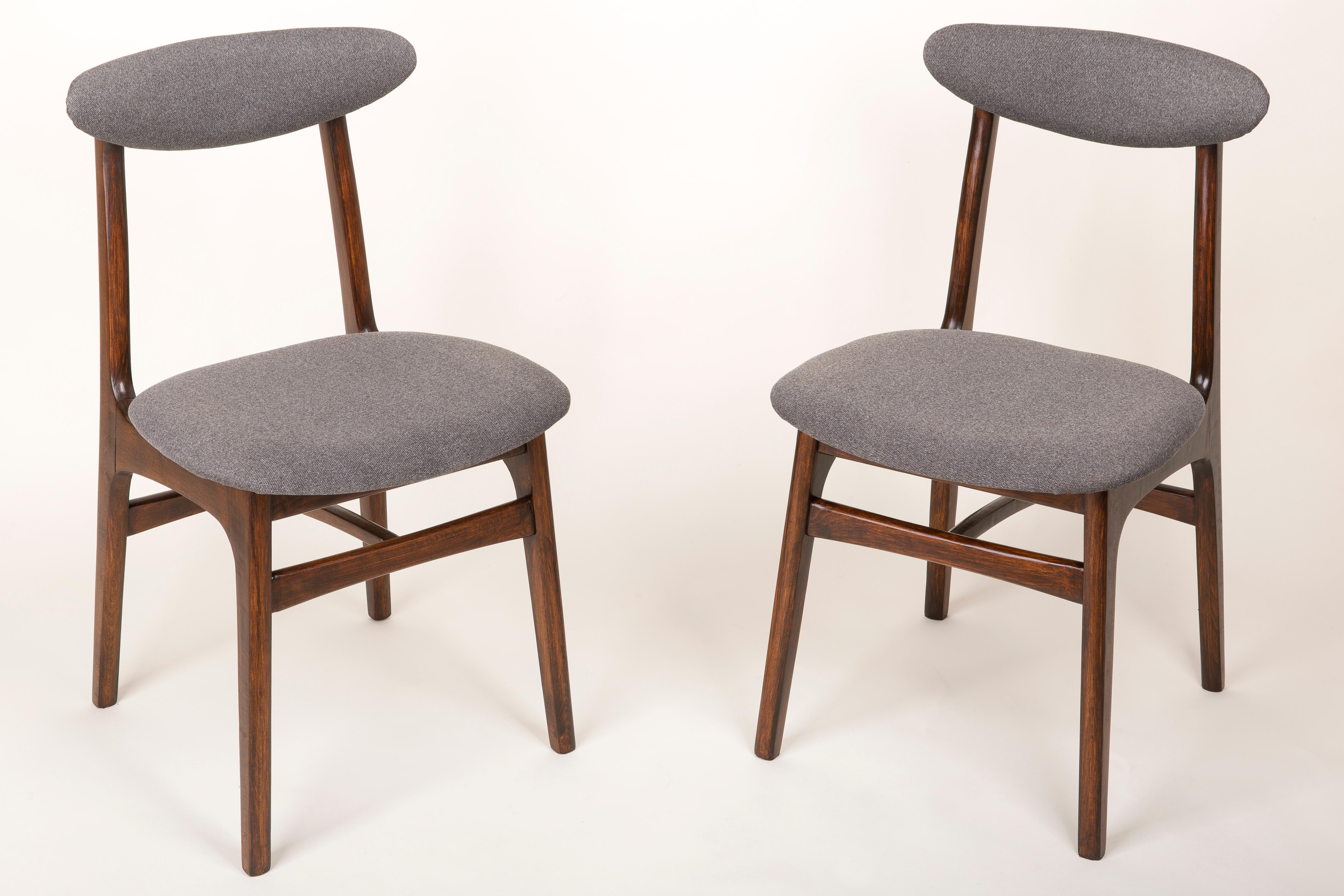 Chairs designed by prof. Rajmund Halas. They have been made of beechwood. They have undergone a complete upholstery renovation, the woodwork has been refreshed. Seats and backs were dressed in a grey, durable and pleasant to the touch fabric. They