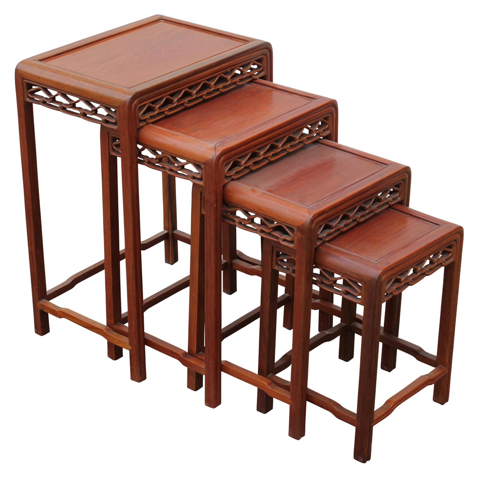 Set of Four 20th Century Modern Carved Chinese Nesting Tables