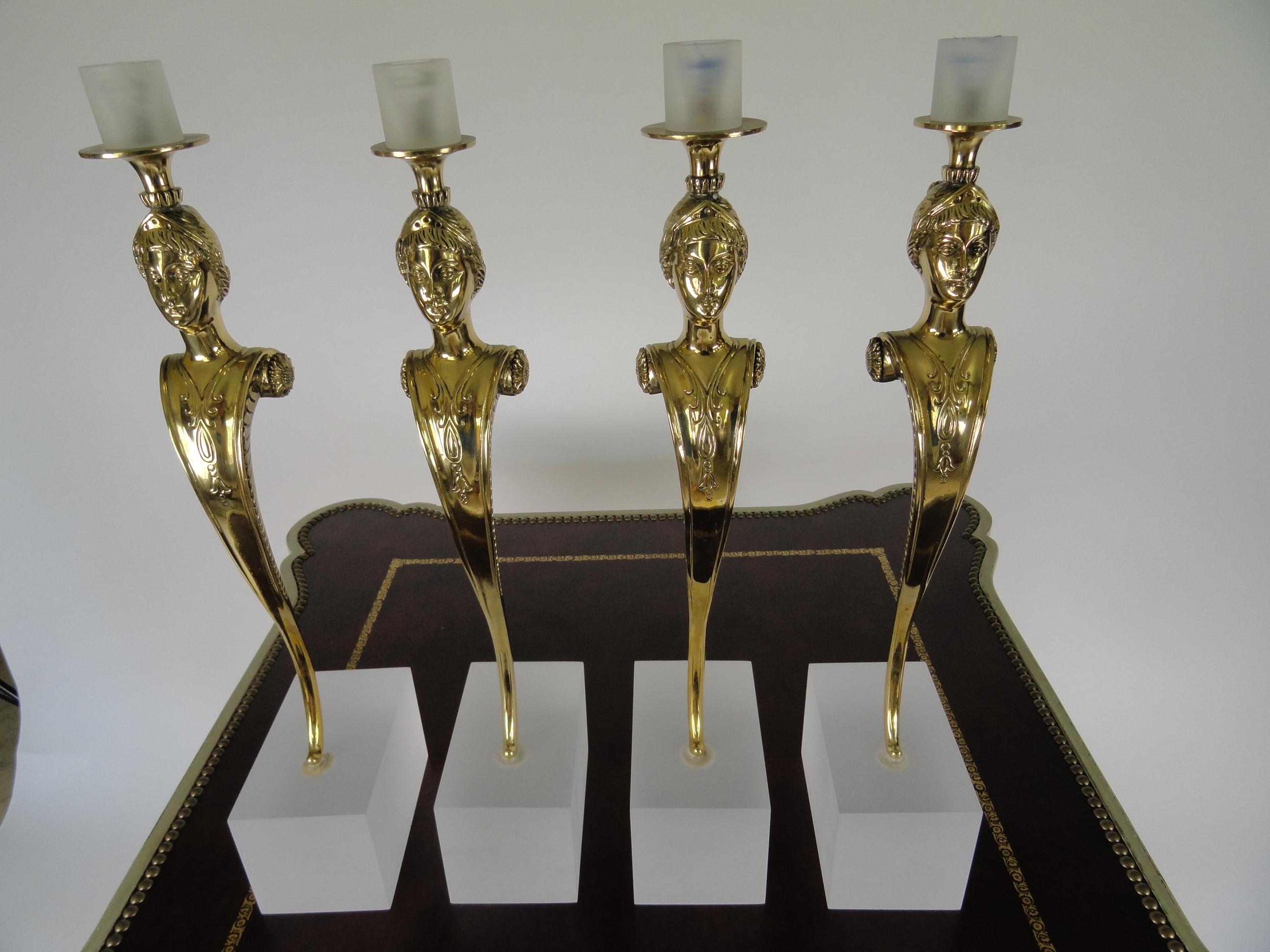 Set of four female figure Italian bronze candleholders featuring beautiful details. Carved breast-plate detail mounted on sand-blasted perspex bases. Candle holders are designed to hold up to 36