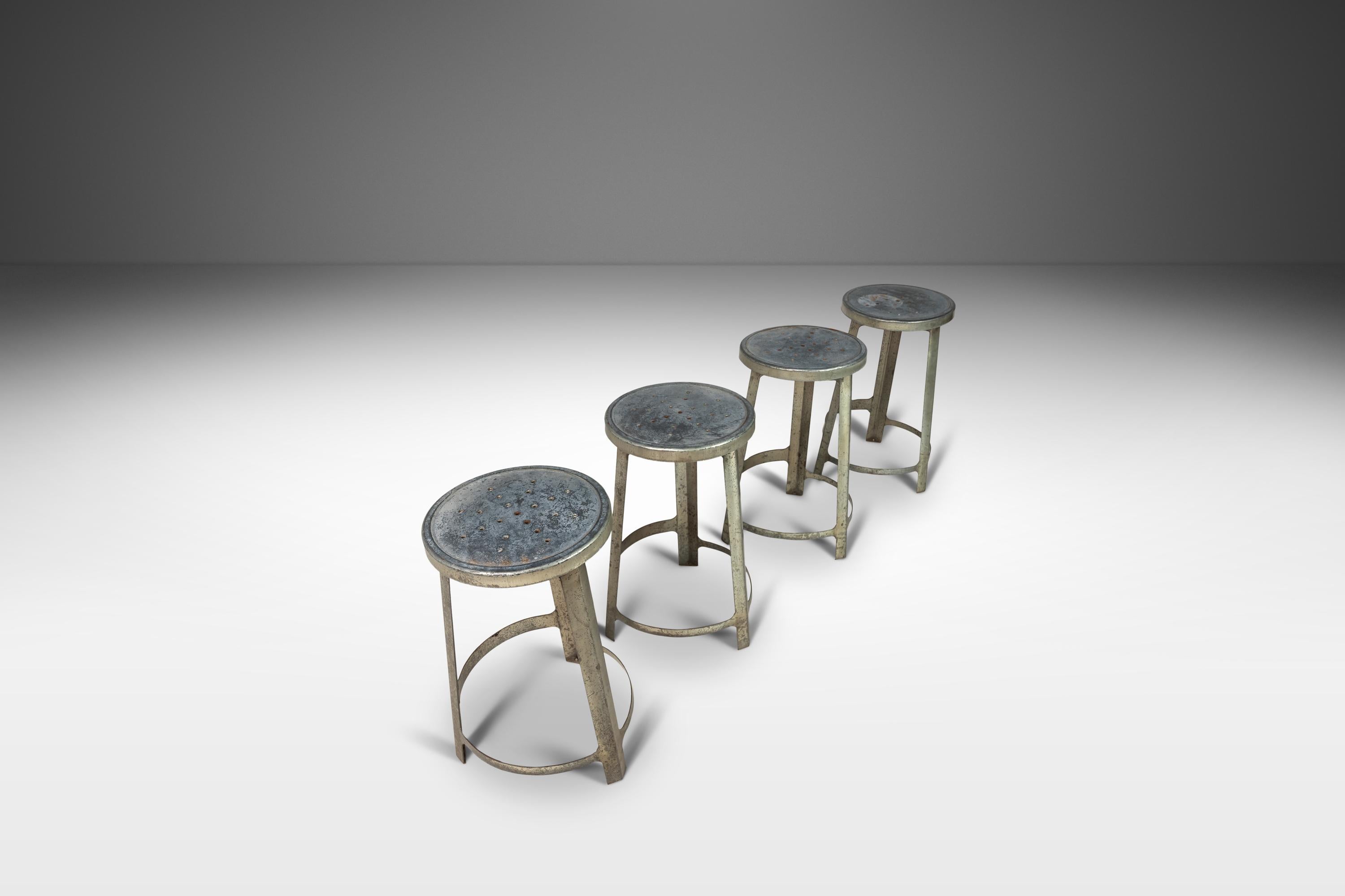 Forged from solid aluminum these exceptional stools were built to last forever. Featuring pierced metal seats, intricate welds and sharp modern angles this set is perfect for collectors and designers alike and are ideal for studio or gallery spaces.