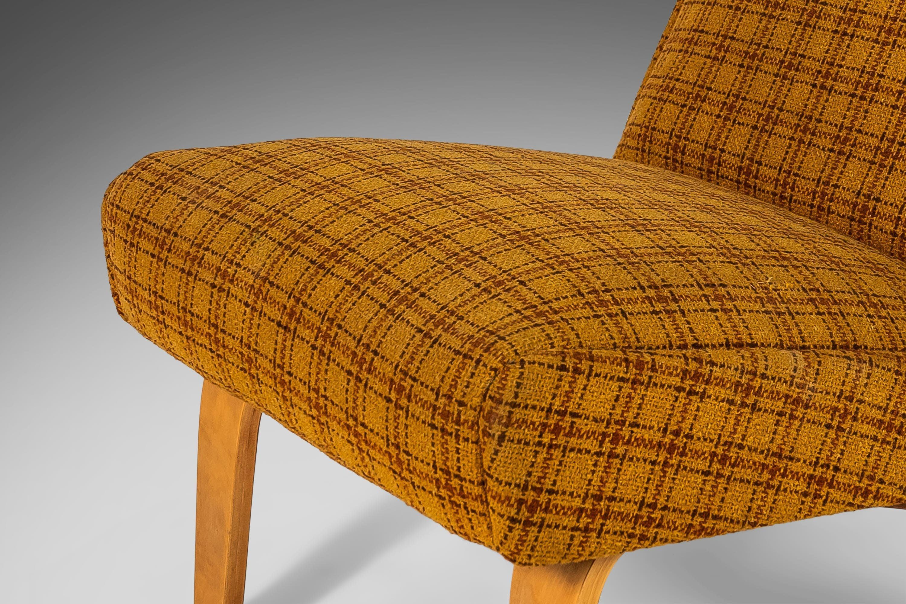 Comfort. Vintage fabric. Captivating bentwood legs. These four slipper chairs are the perfect addition to any space needing a pop of color or a minimal footprint. The original yellow plaid upholstery gives these splendid chairs tons of character and