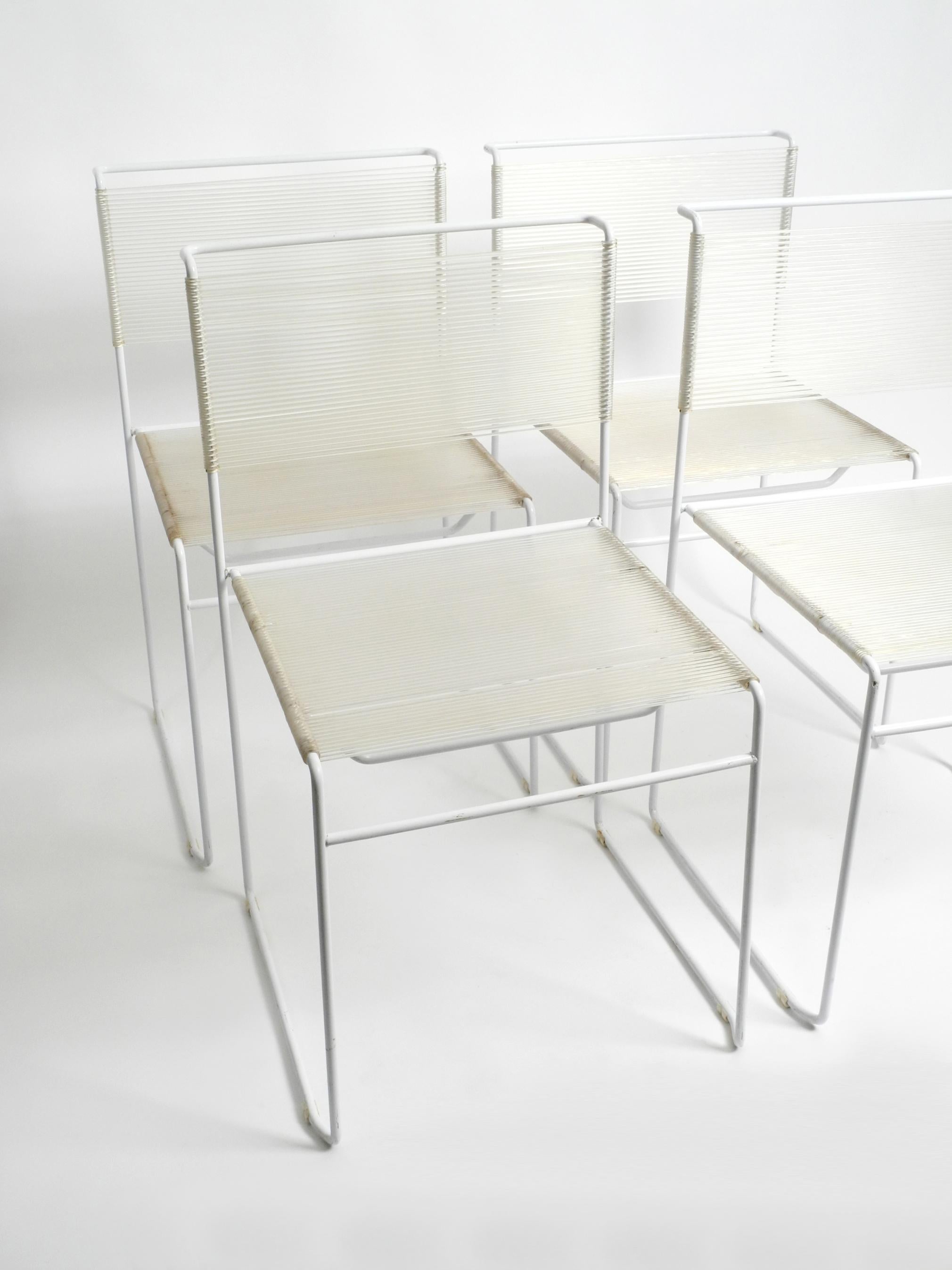 Set of four 1970s orignal Spagetti chairs in white by Giandomenico Belotti.
Manufacturer is Fly Line by CMP Padova. Made in Italy. 
Rare in white lacquered frame.
Gorgeous Minimalist Italian design from the Pop Art era.
Very good condition with