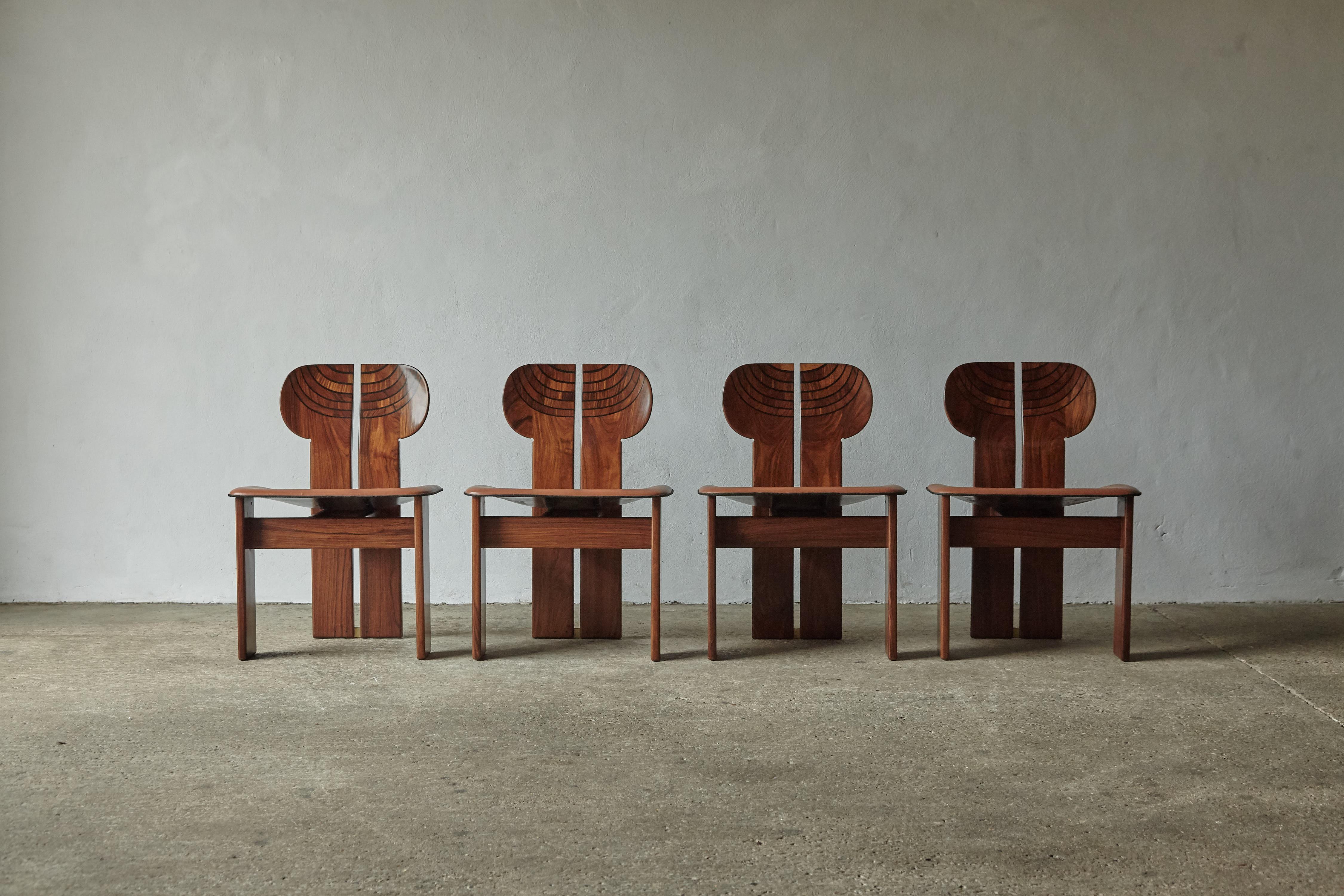A rare set of four stunning Africa chairs designed by Afra & Tobia Scarpa in the 1970s, and produced by Maxalto, Italy. These are great examples in rare exotic hardwood, burl, black leather and brass. Good original condition with normal minor age