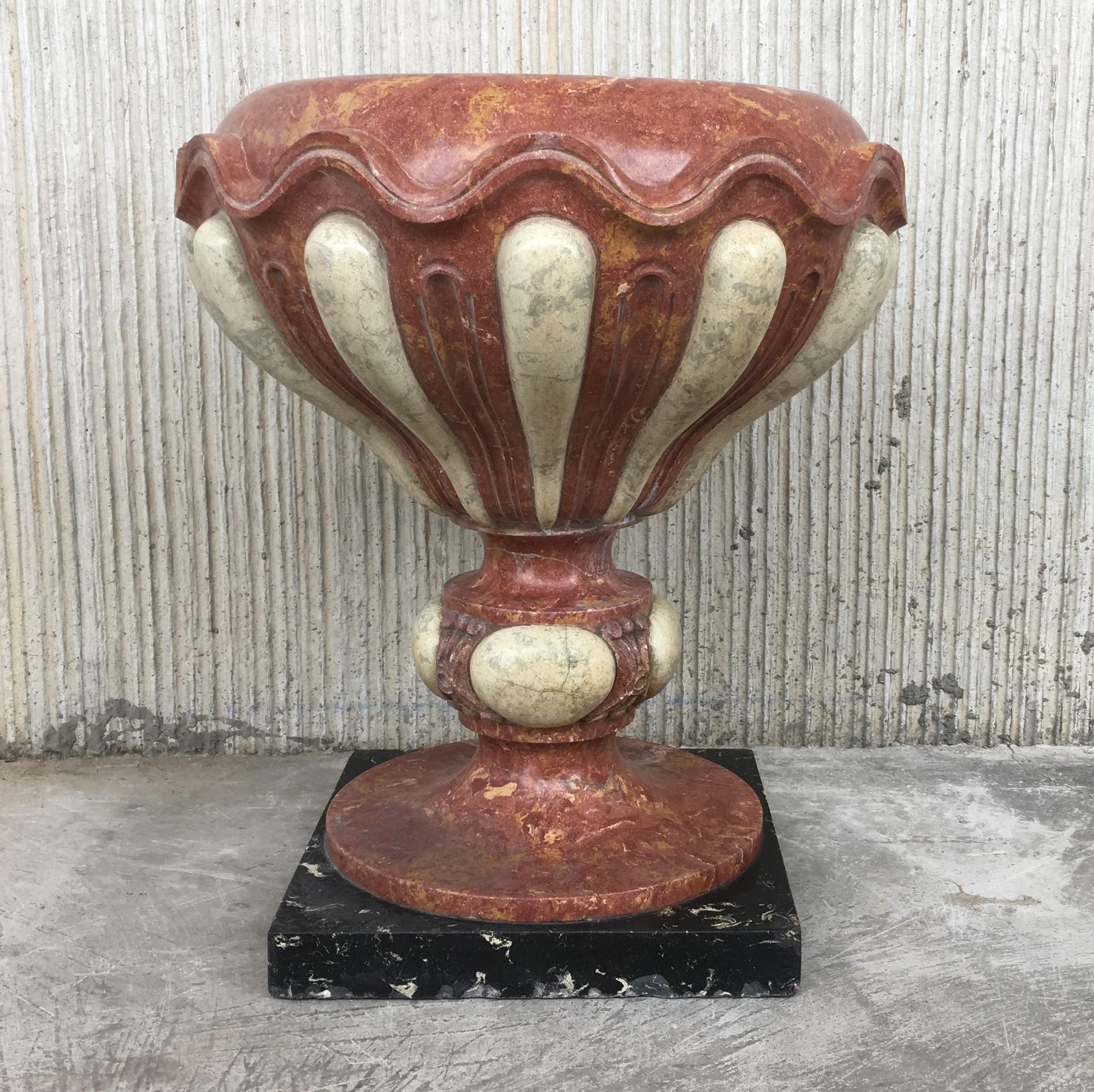 Set of four of aged pink marble hand carved planters with Serpentine white inlays and black marble base

Price per item.