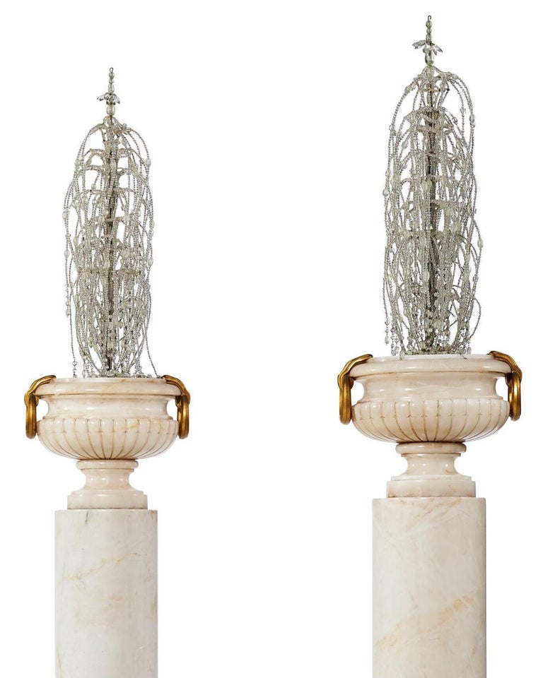 Set of Four Alabaster Urns with Beaded Glass Ornaments on Pedestals For