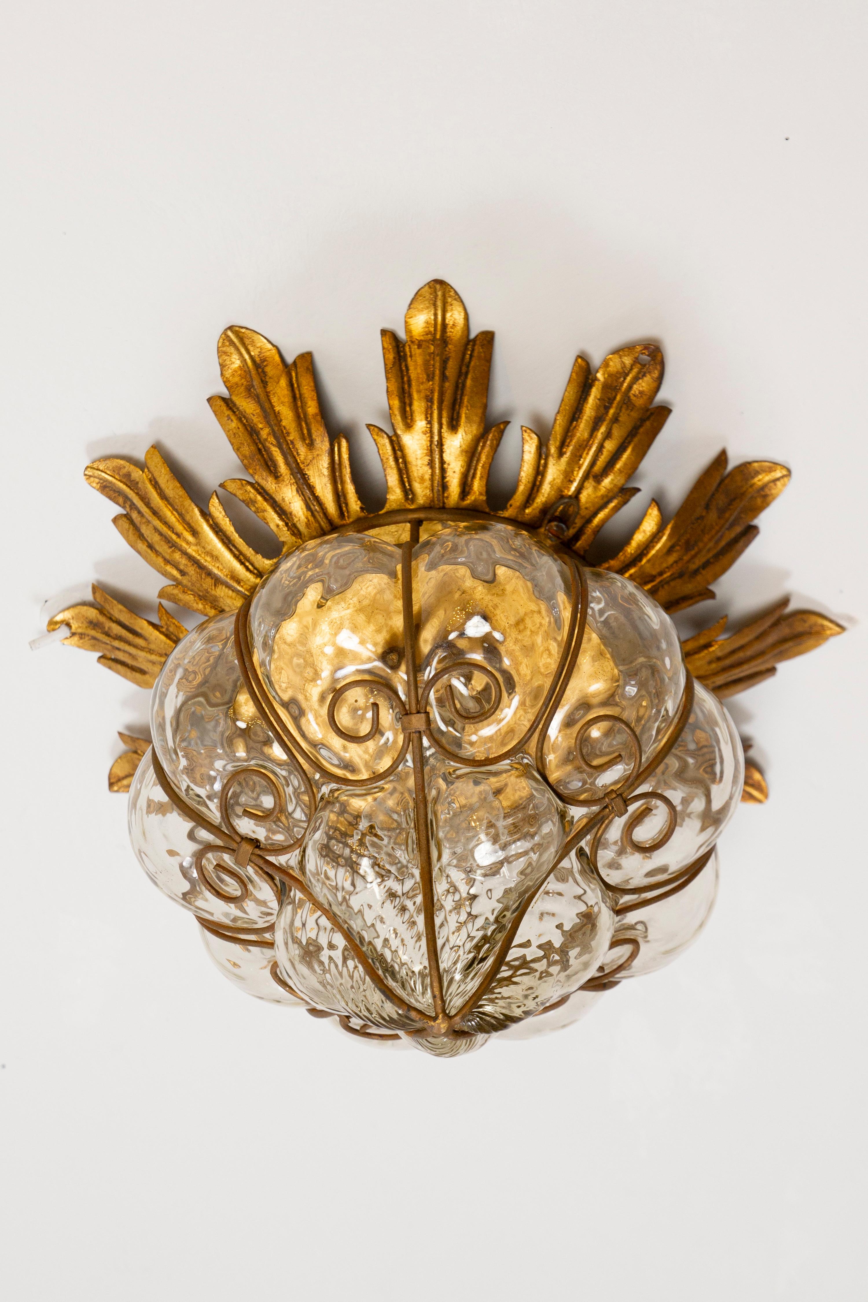Set of Four  gold iron and  Murano  hand blown glass ceiling lights , typical example of the renowned Venetian glassworks.
Very good original vintage condition. 