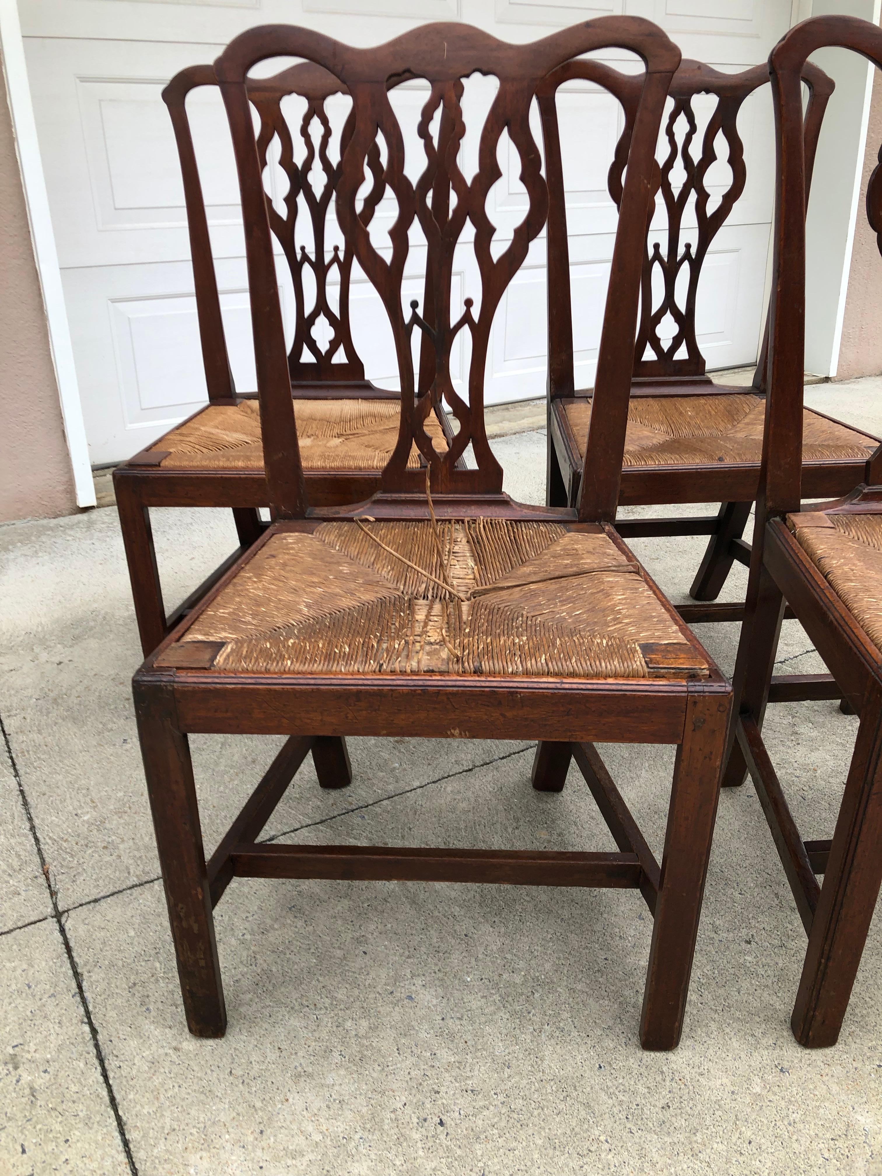Set of four American Chippendale walnut side chairs, slip rush seats, circa 1770.