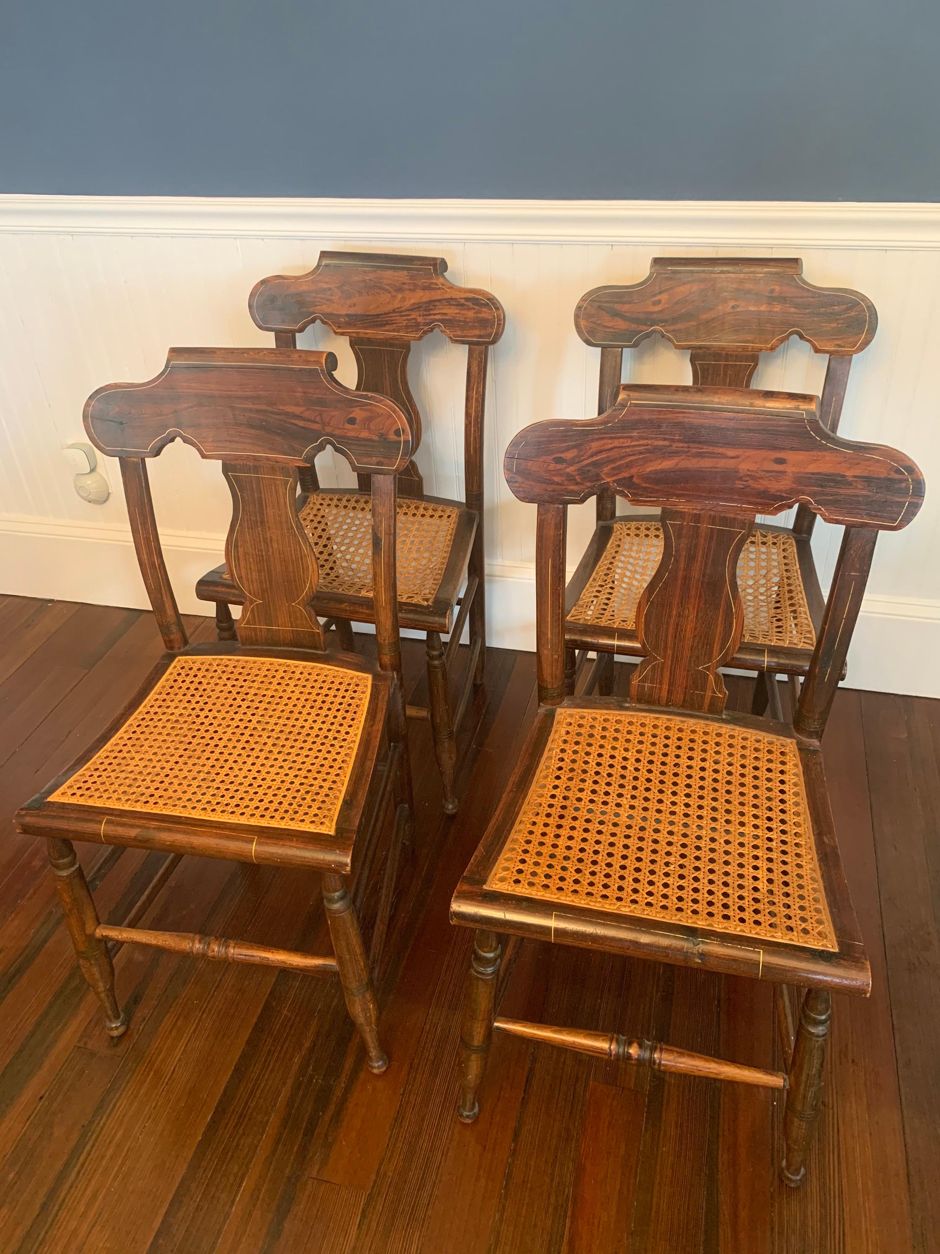 Set of four American Classical painted faux grain rosewood & caned dining chairs -
A really lovely set of four chairs with faux painted rosewood design on the back and legs with delicate gold highlight line on the back (rubbed in some areas). Seats