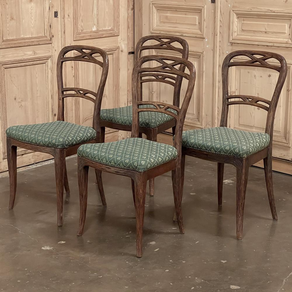 Set of four antique chairs by Horrix are perfect examples of the highest quality furnishings produced by the storied Dutch company. Displaying a Black Forest style influence, each was rendered out of solid old-growth oak, and features carvings that