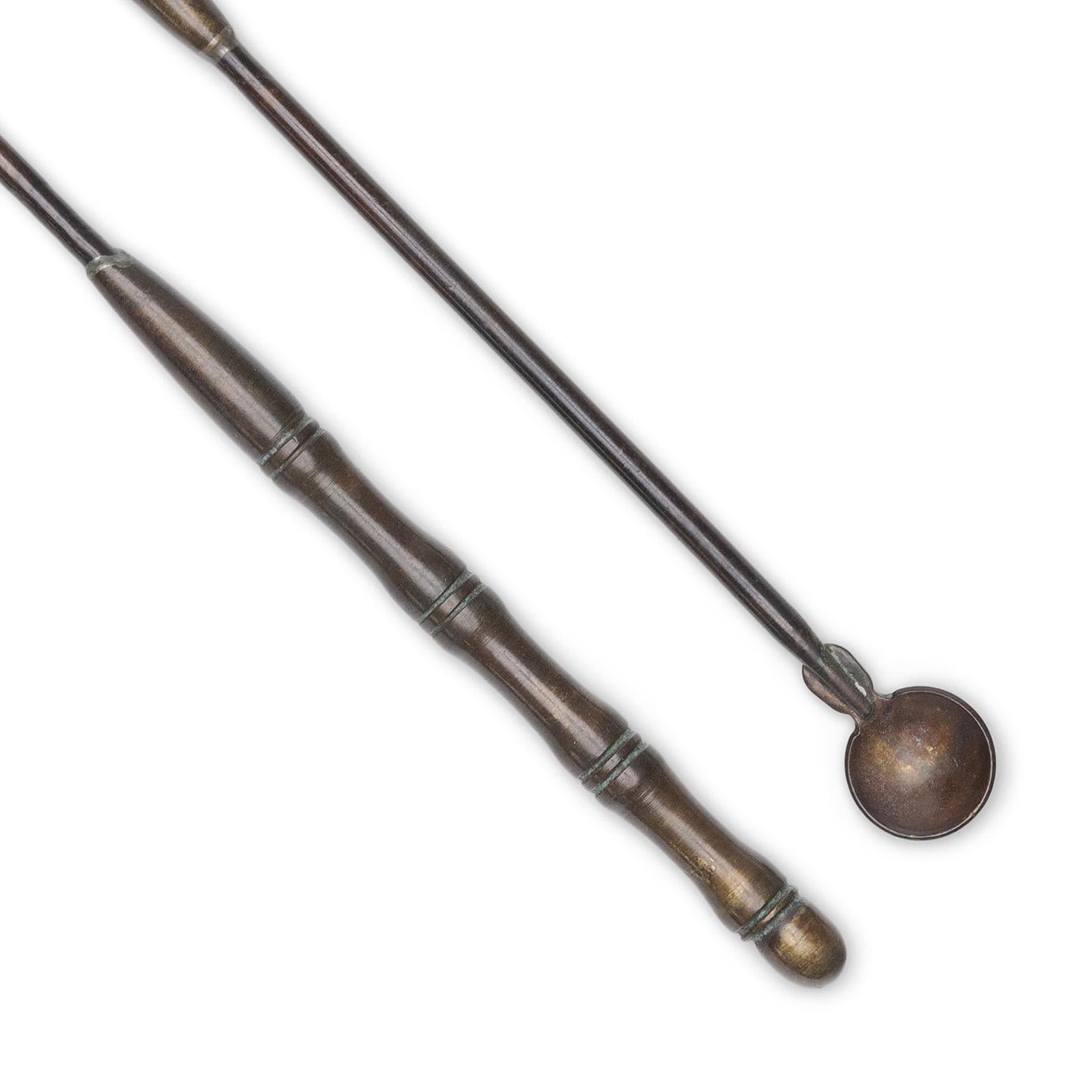 These petite tools date to the mid- to late 19th century and were originally among the many accessories that comprised an opium smoking kit. 

The set includes three opium scrapers, used to remove spent ash and debris from a pipe stem or pipe bowl,