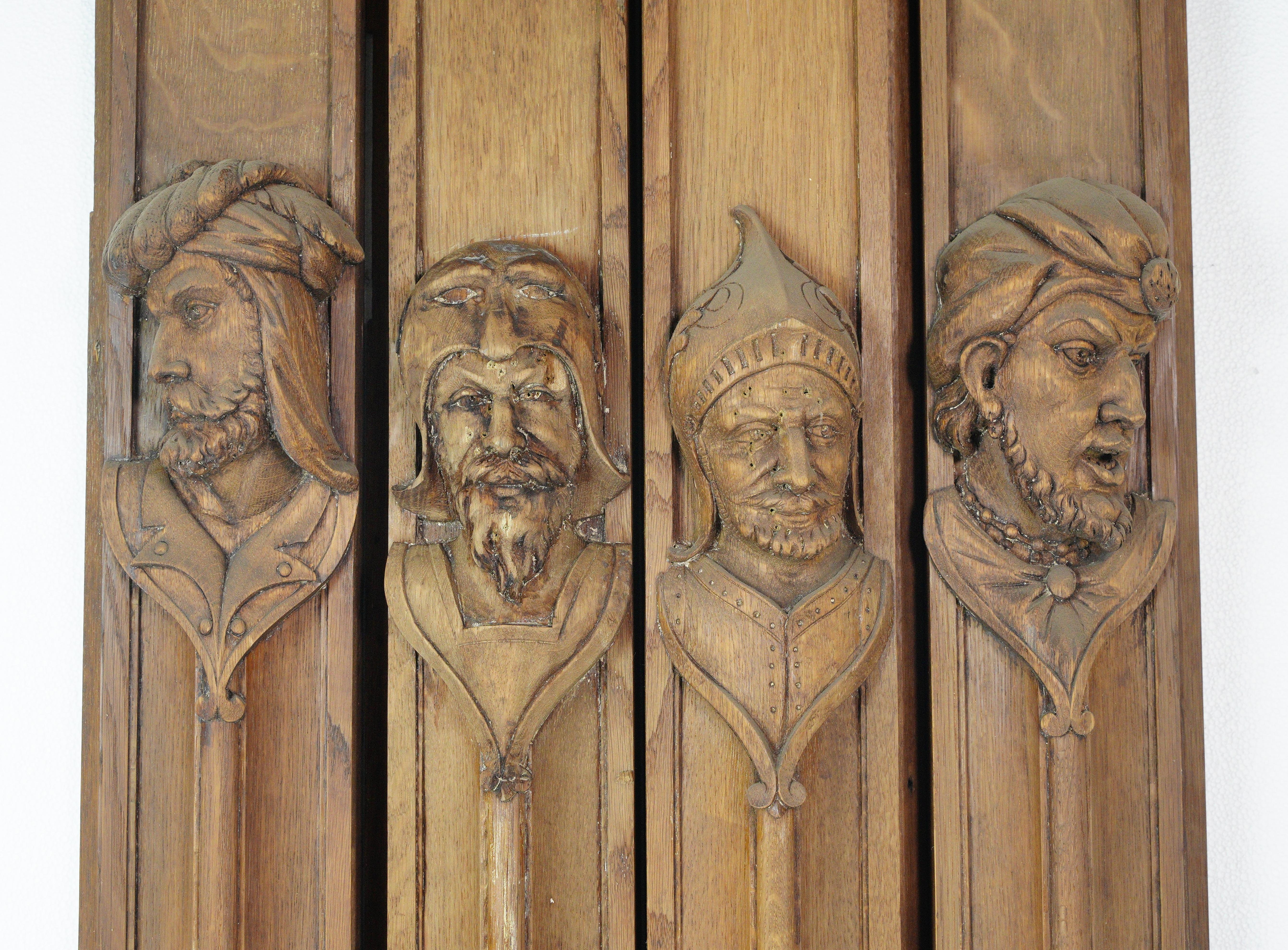 Decorate with a touch of medieval charm with this set of antique solid chestnut door pilasters featuring intricate hand carved faces. These architectural masterpieces add historical character and elegance to any entryway or interior space. They are