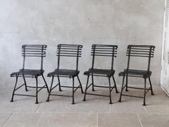 Set of four antique French Arras garden chairs with claw feet