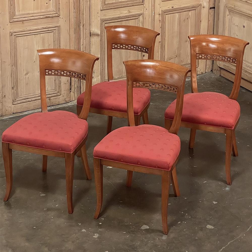Set of four antique French Directoire style chairs in Maple is a perfect example of the refined, graceful neoclassical style that was founded during the days of Napoleon. This set was hand-crafted from dense maple and given a rich cherry tone stain